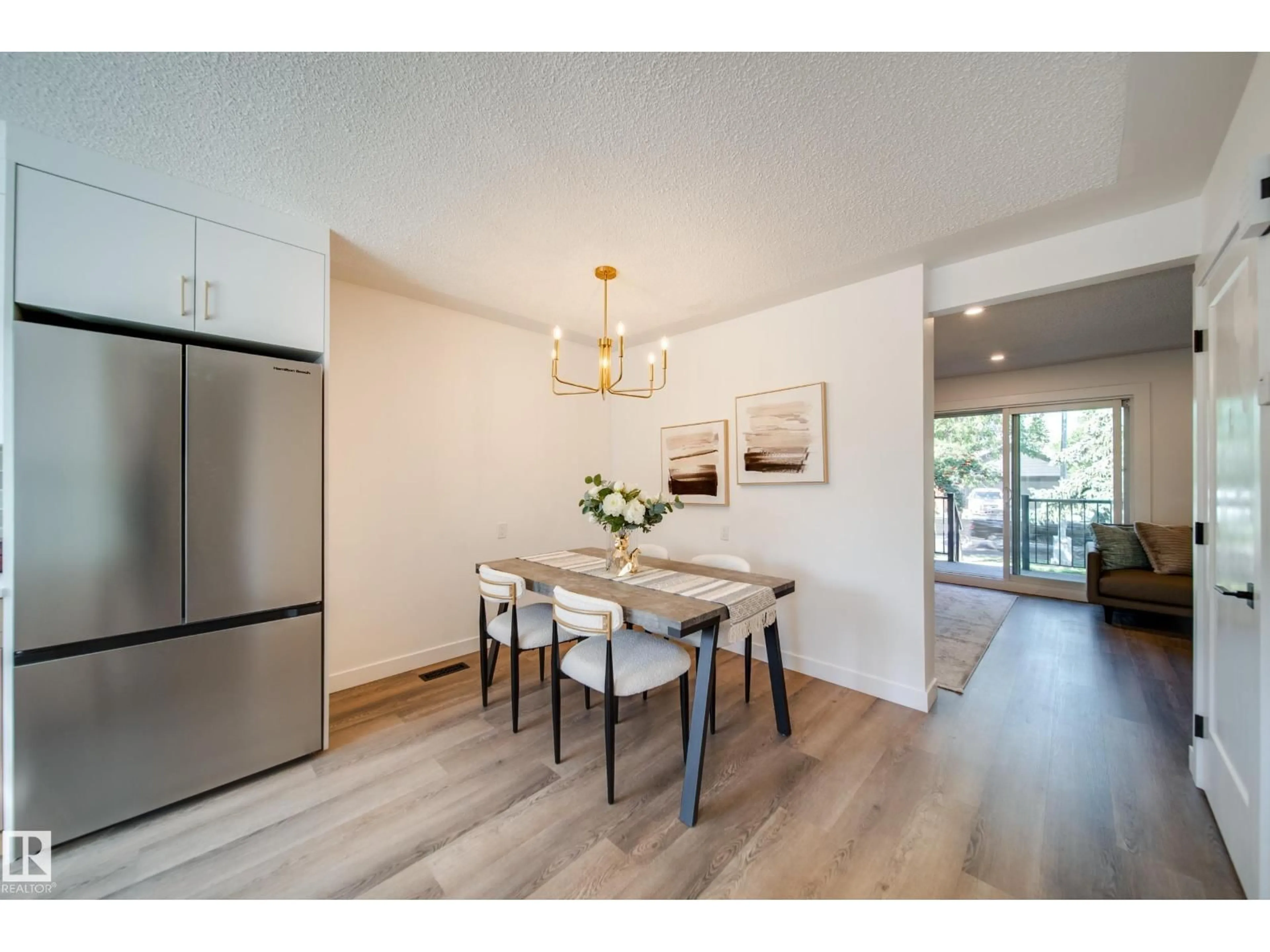 Dining room, wood/laminate floor for 9949 171 AV, Edmonton Alberta T5X4X2
