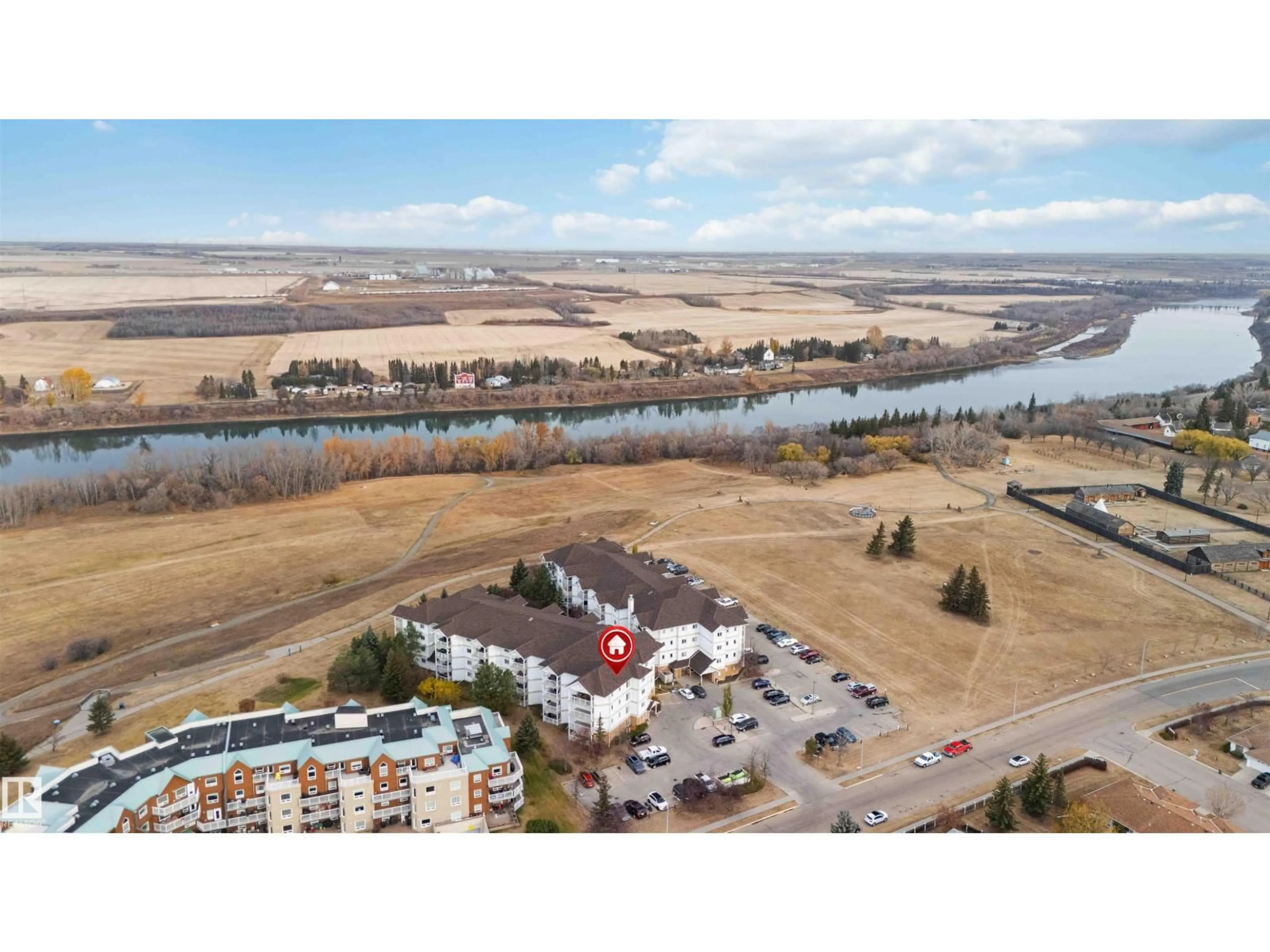 A pic from outside/outdoor area/front of a property/back of a property/a pic from drone, water/lake/river/ocean view for 105 - 9930 100, Fort Saskatchewan Alberta T8L4P3