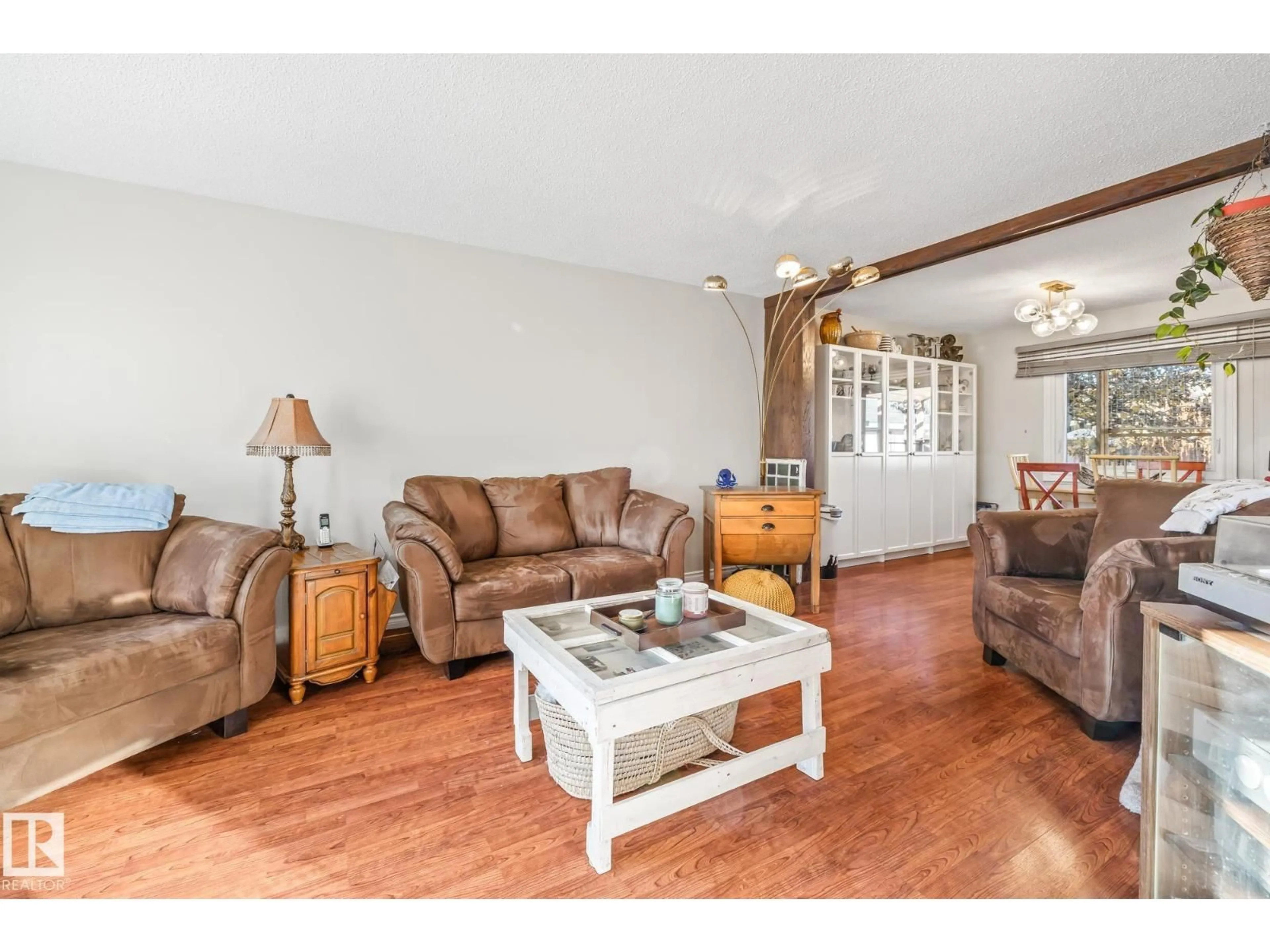 Living room with furniture, wood/laminate floor for 3728 132 AV, Edmonton Alberta T5A3E7