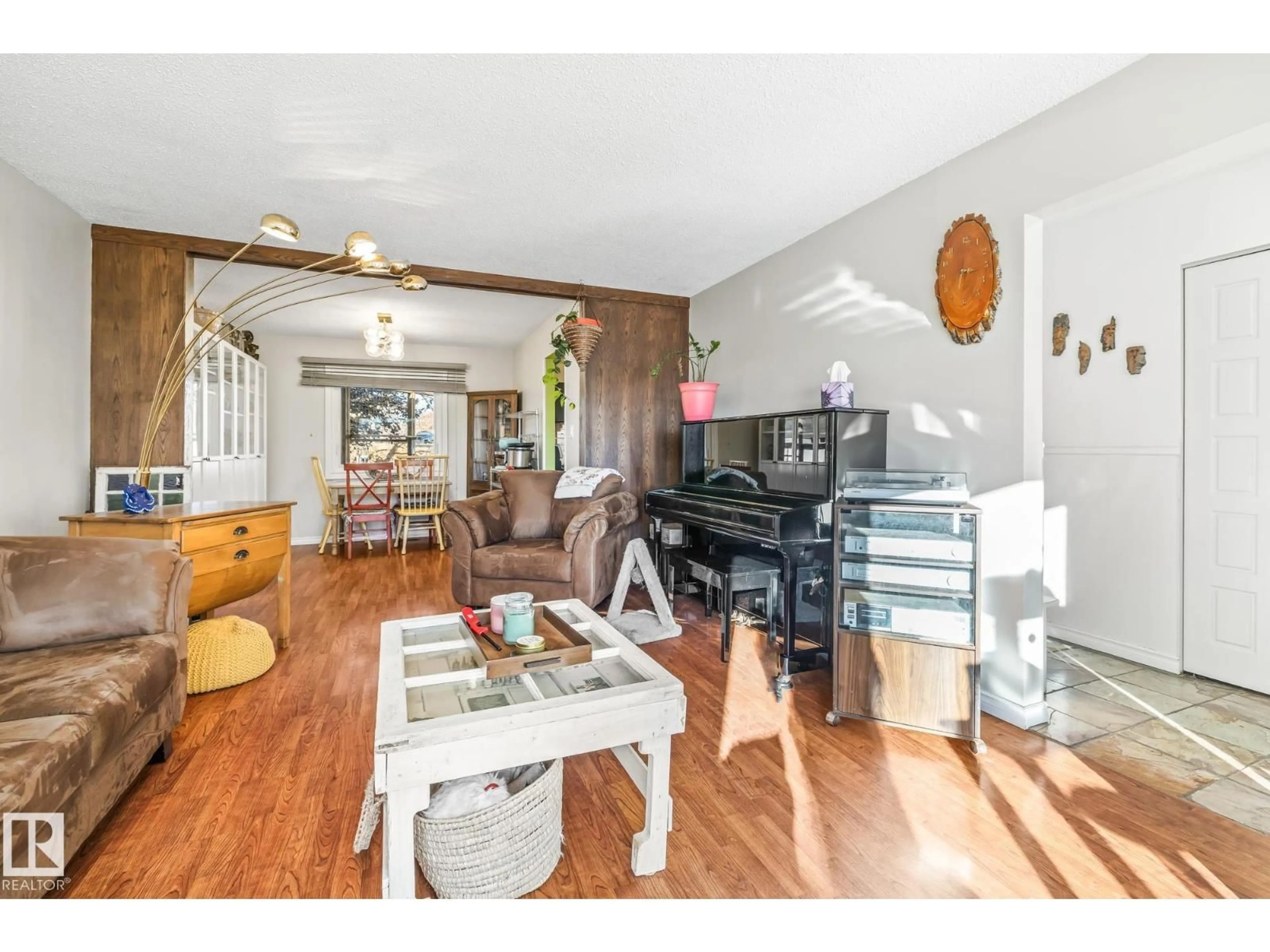 Living room with furniture, wood/laminate floor for 3728 132 AV, Edmonton Alberta T5A3E7