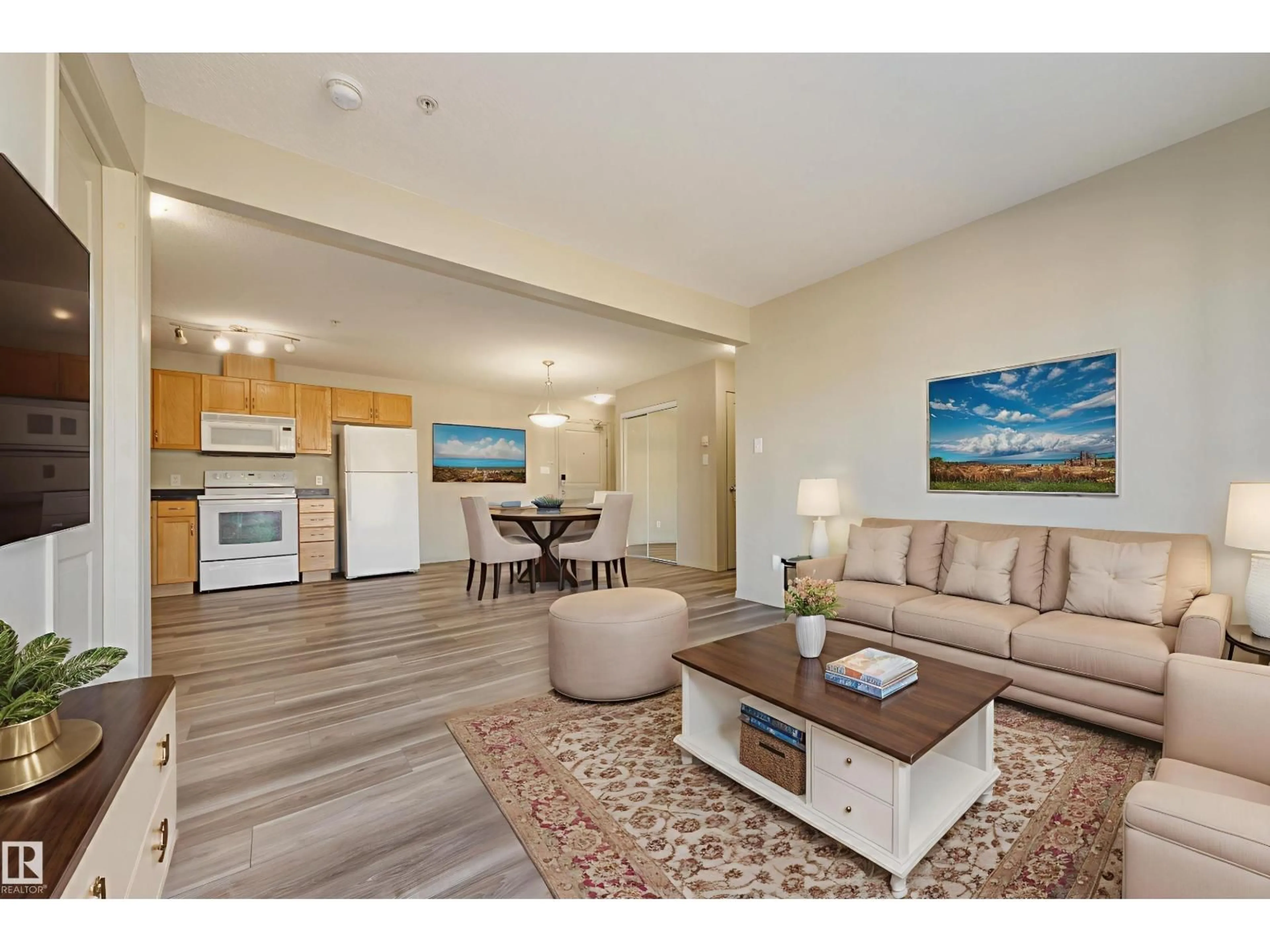Living room with furniture, wood/laminate floor for 309 - 317 CLAREVIEW STATION DR, Edmonton Alberta T5Y0C5