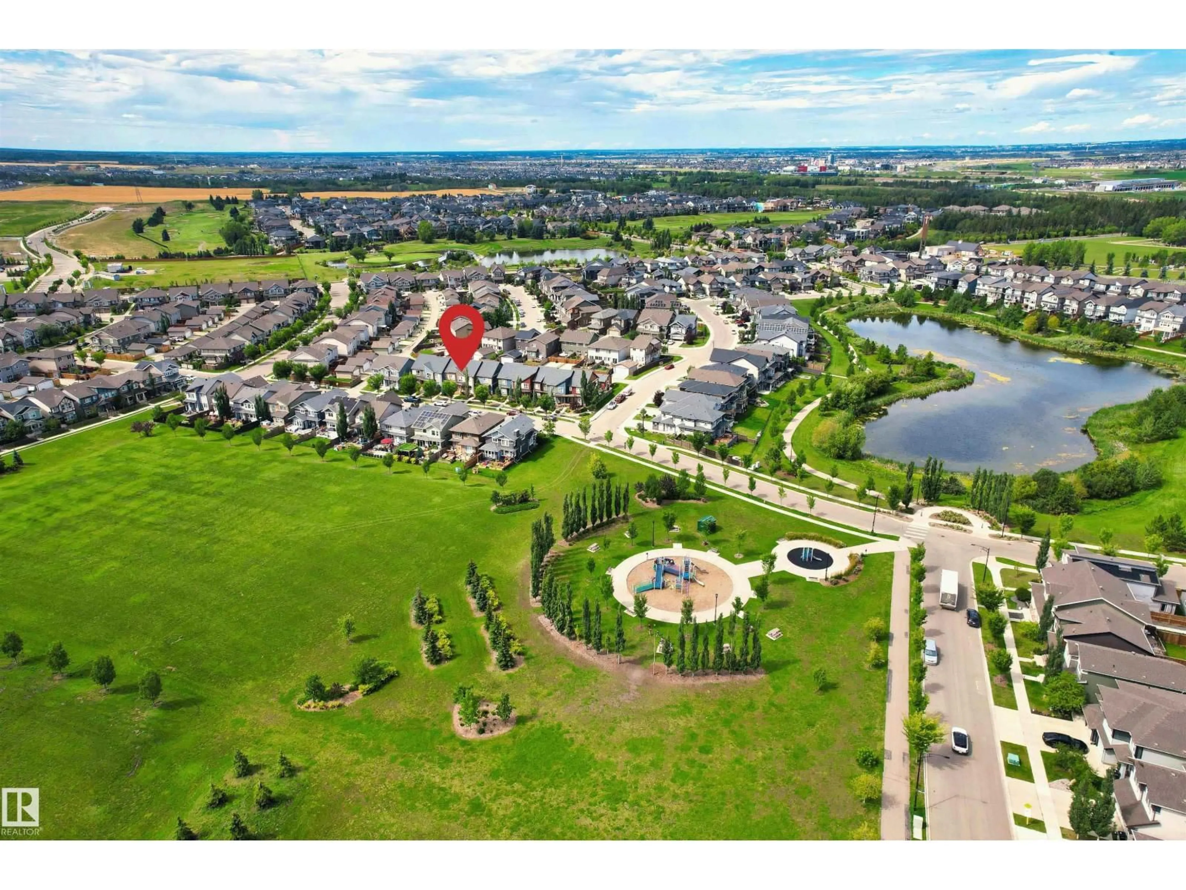 A pic from outside/outdoor area/front of a property/back of a property/a pic from drone, water/lake/river/ocean view for 3072 PAISLEY GREEN GR, Edmonton Alberta T6W2X1