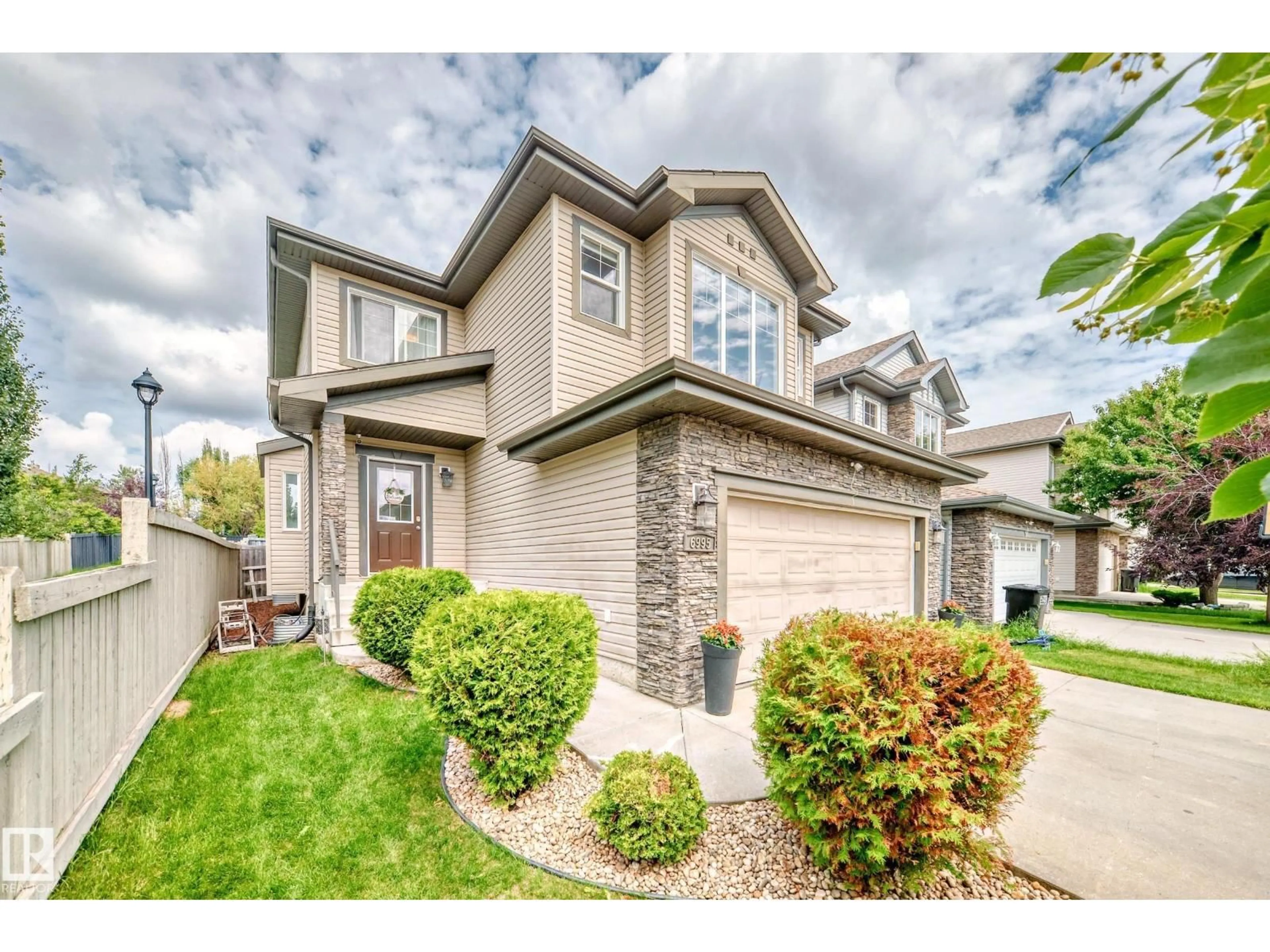 Home with vinyl exterior material, street for 6995 STROM LN, Edmonton Alberta T6R0P1