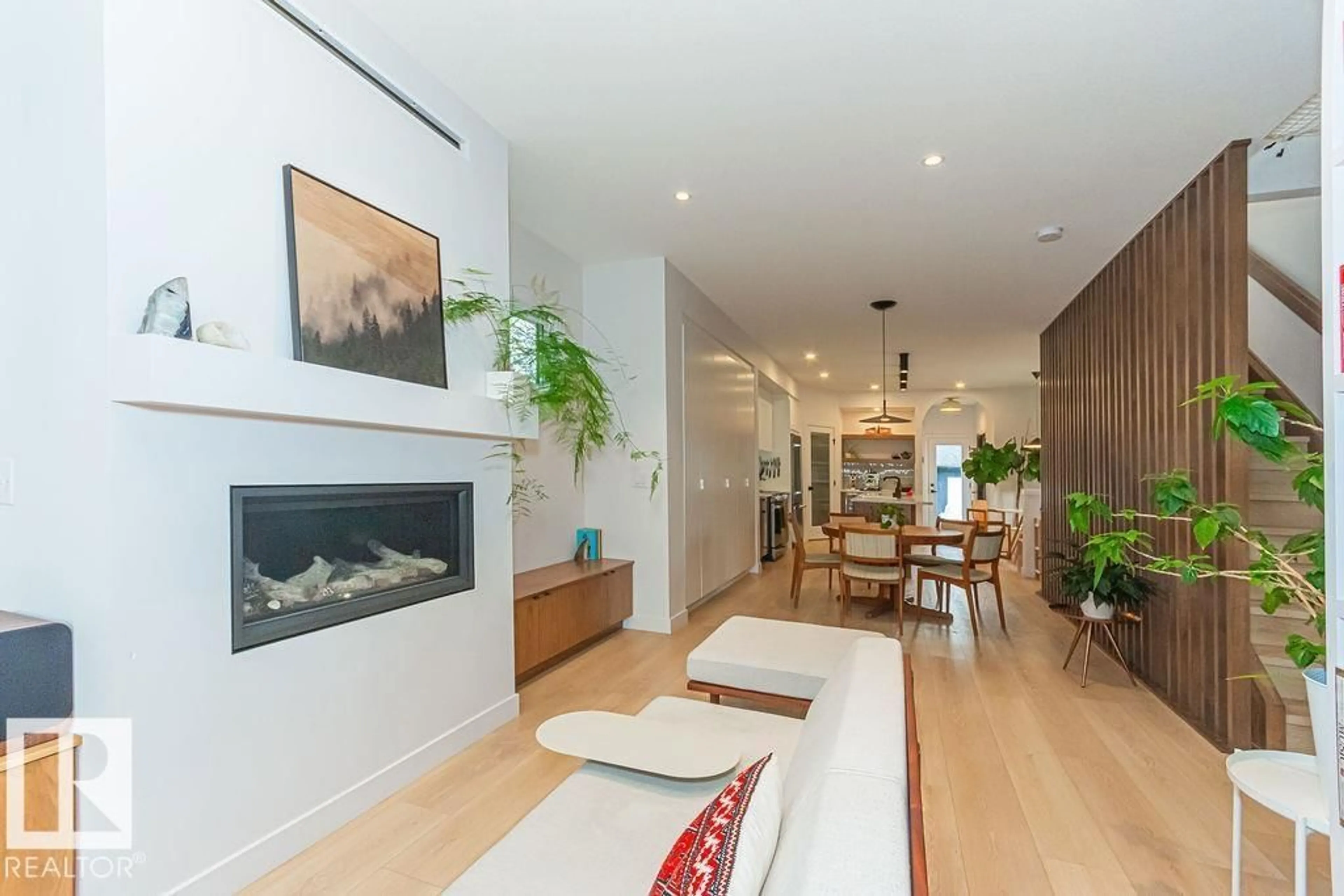 Living room with furniture, wood/laminate floor for NW - 11211 61 ST, Edmonton Alberta T5W4A4