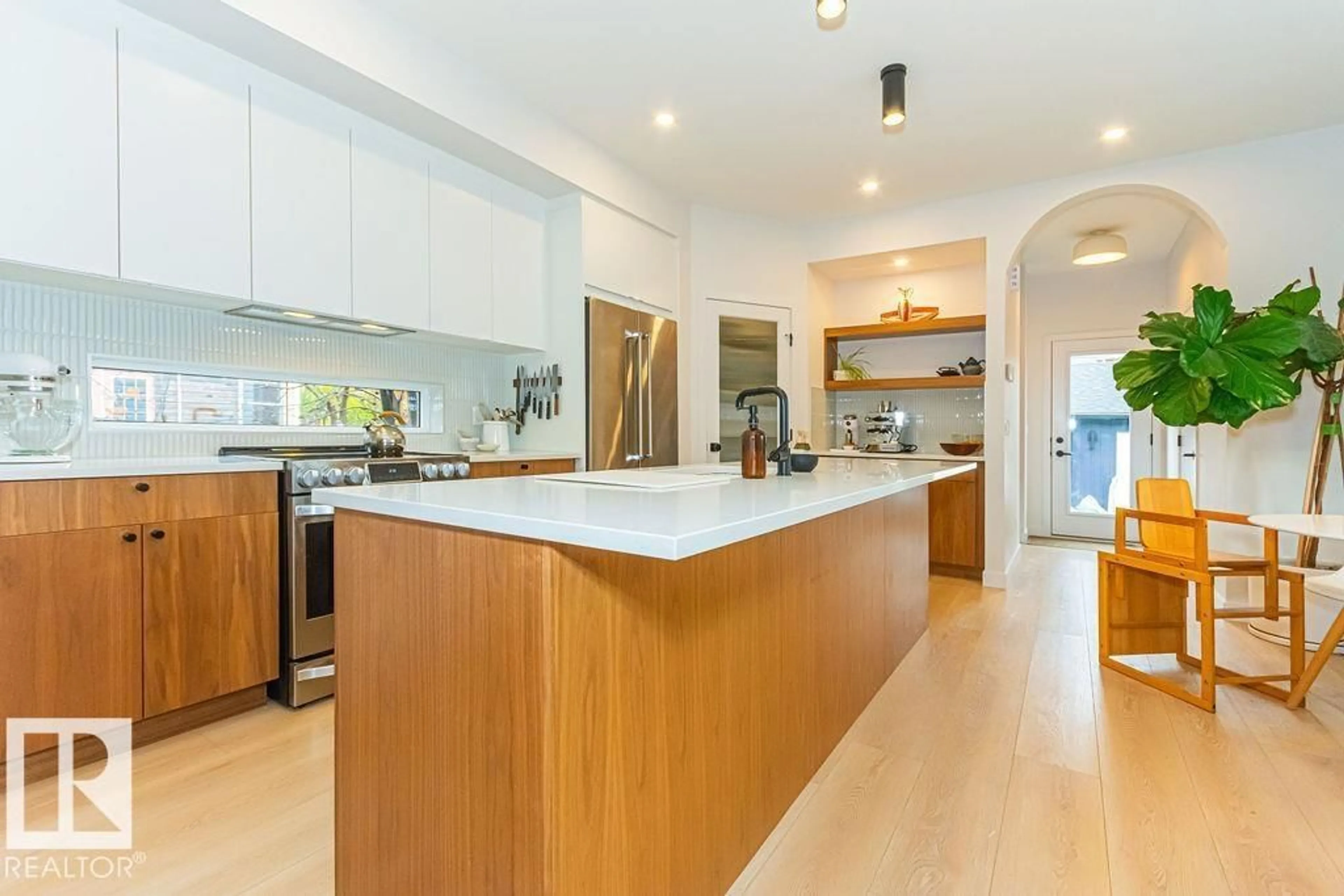 Open concept kitchen, wood/laminate floor for NW - 11211 61 ST, Edmonton Alberta T5W4A4