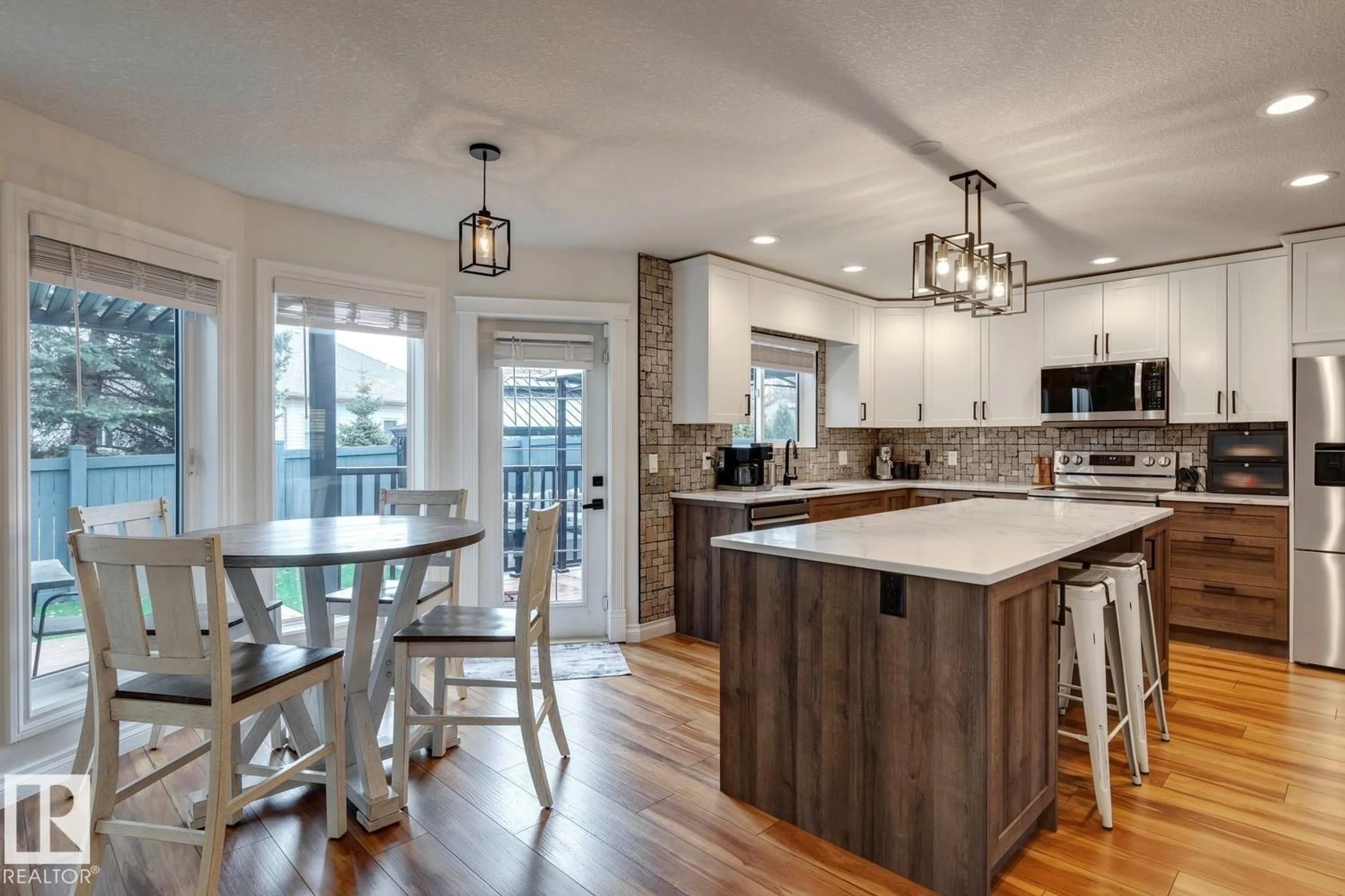 Open concept kitchen, wood/laminate floor for SW - 1847 BOWMAN PT, Edmonton Alberta T6W1P7