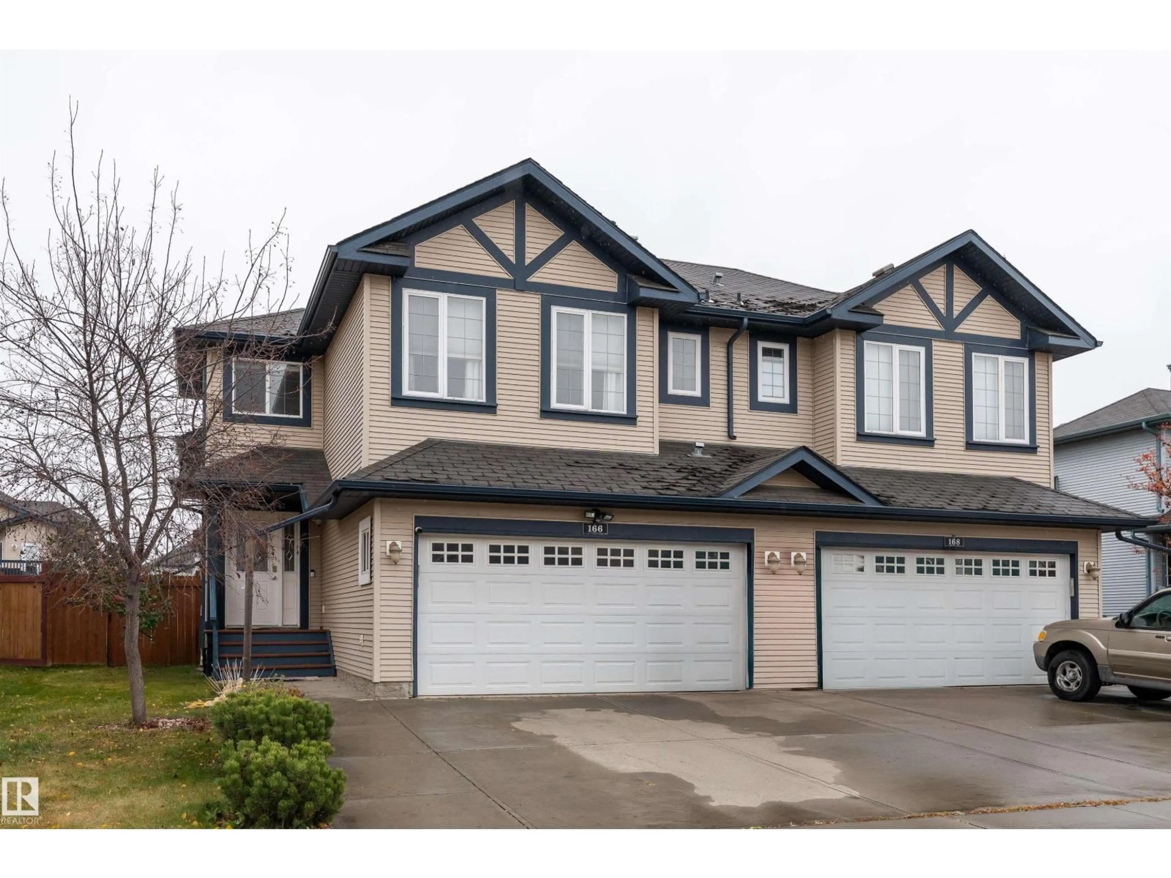 Home with vinyl exterior material, street for 166 RUE MAGNAN, Beaumont Alberta T4X0A6