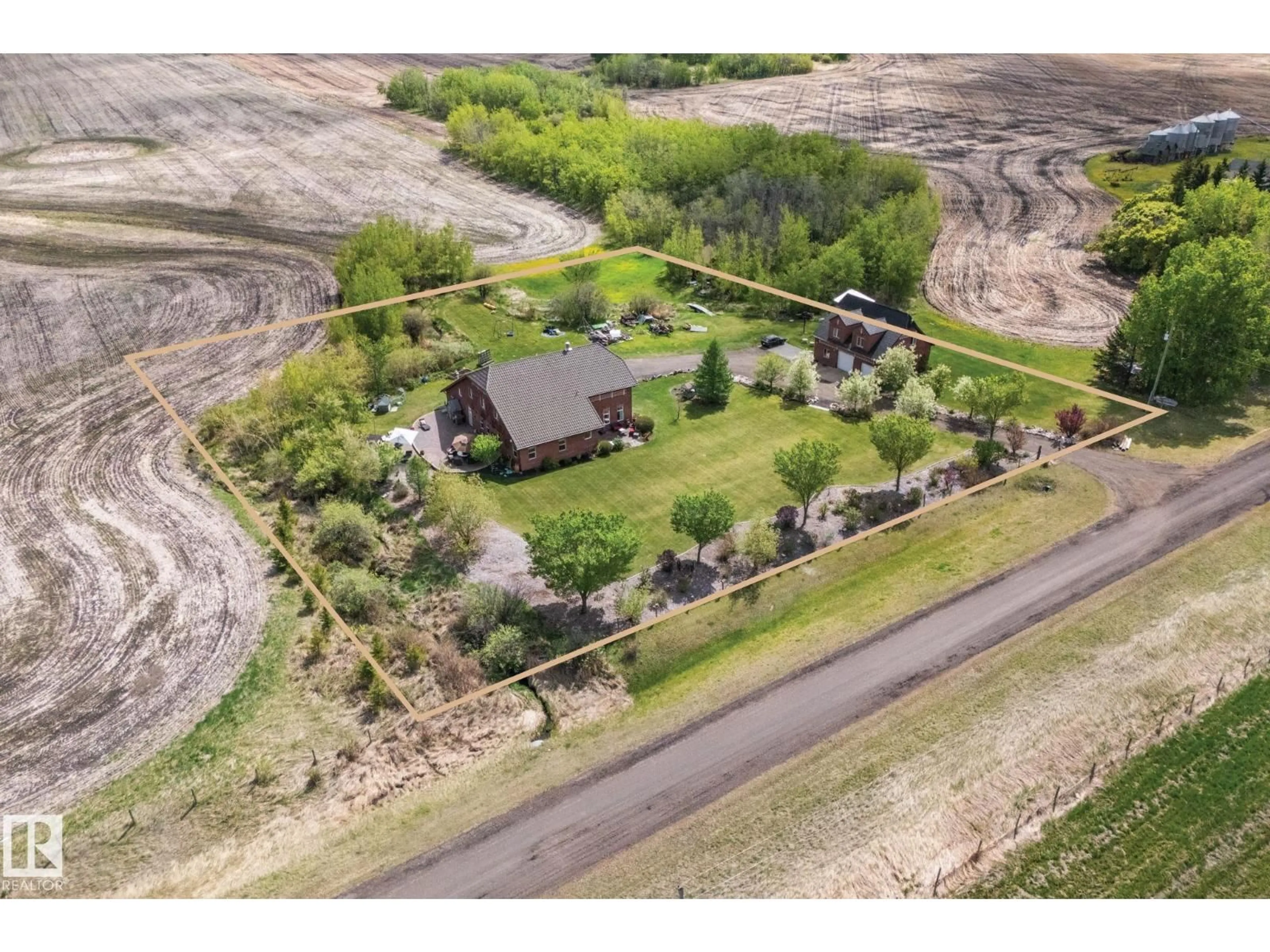 A pic from outside/outdoor area/front of a property/back of a property/a pic from drone, unknown for 53341 HWY 21, Rural Strathcona County Alberta T8A4V1