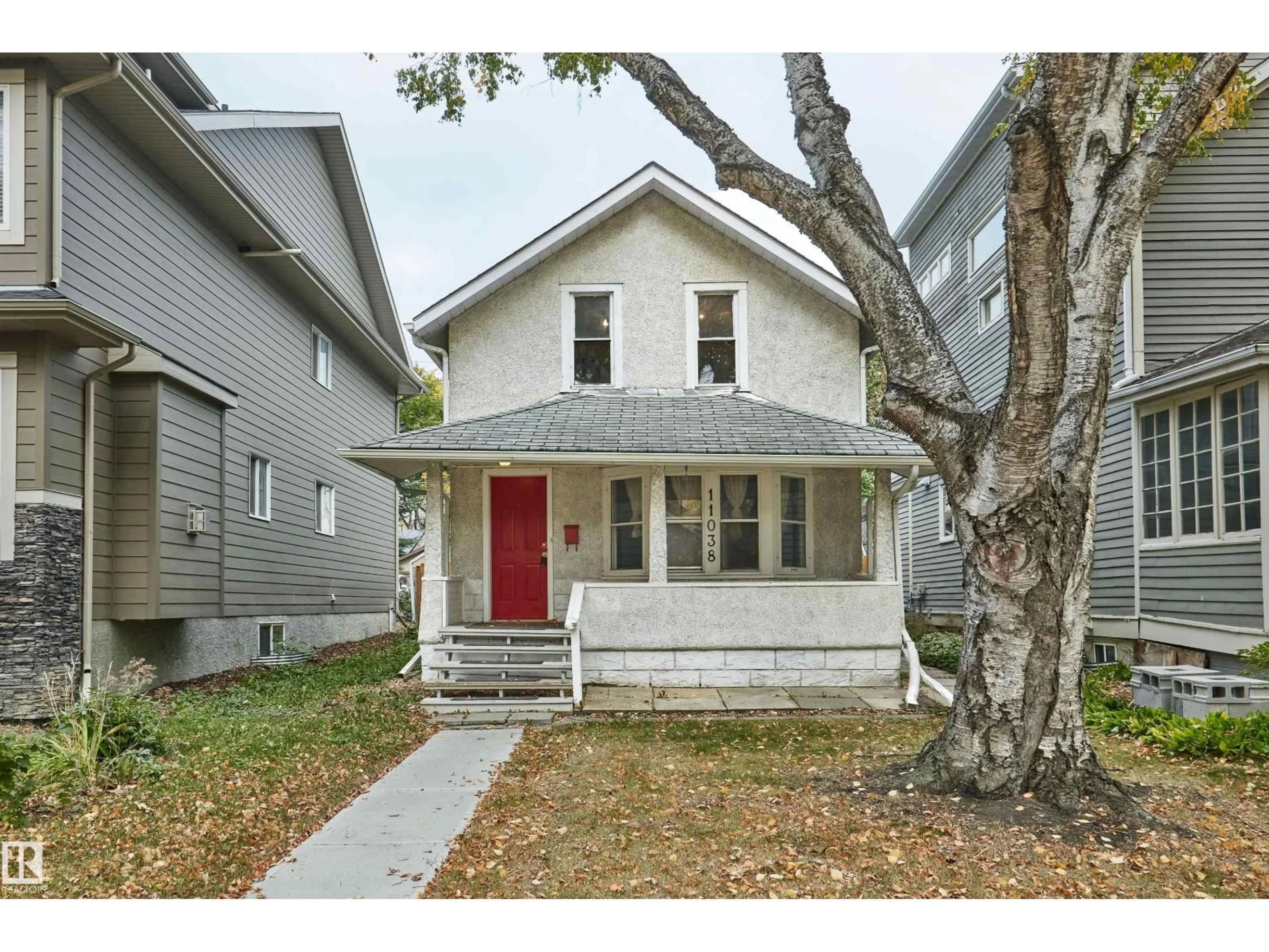 Home with vinyl exterior material, street for 11038 84 AV, Edmonton Alberta T6G0V7