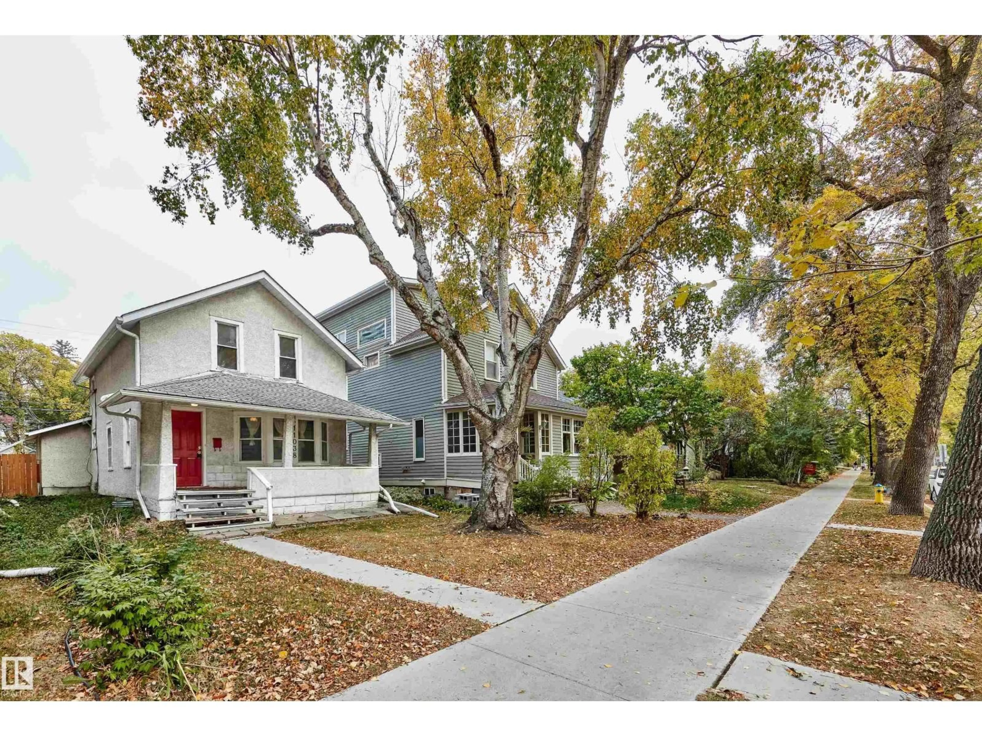 Home with vinyl exterior material, street for 11038 84 AV, Edmonton Alberta T6G0V7