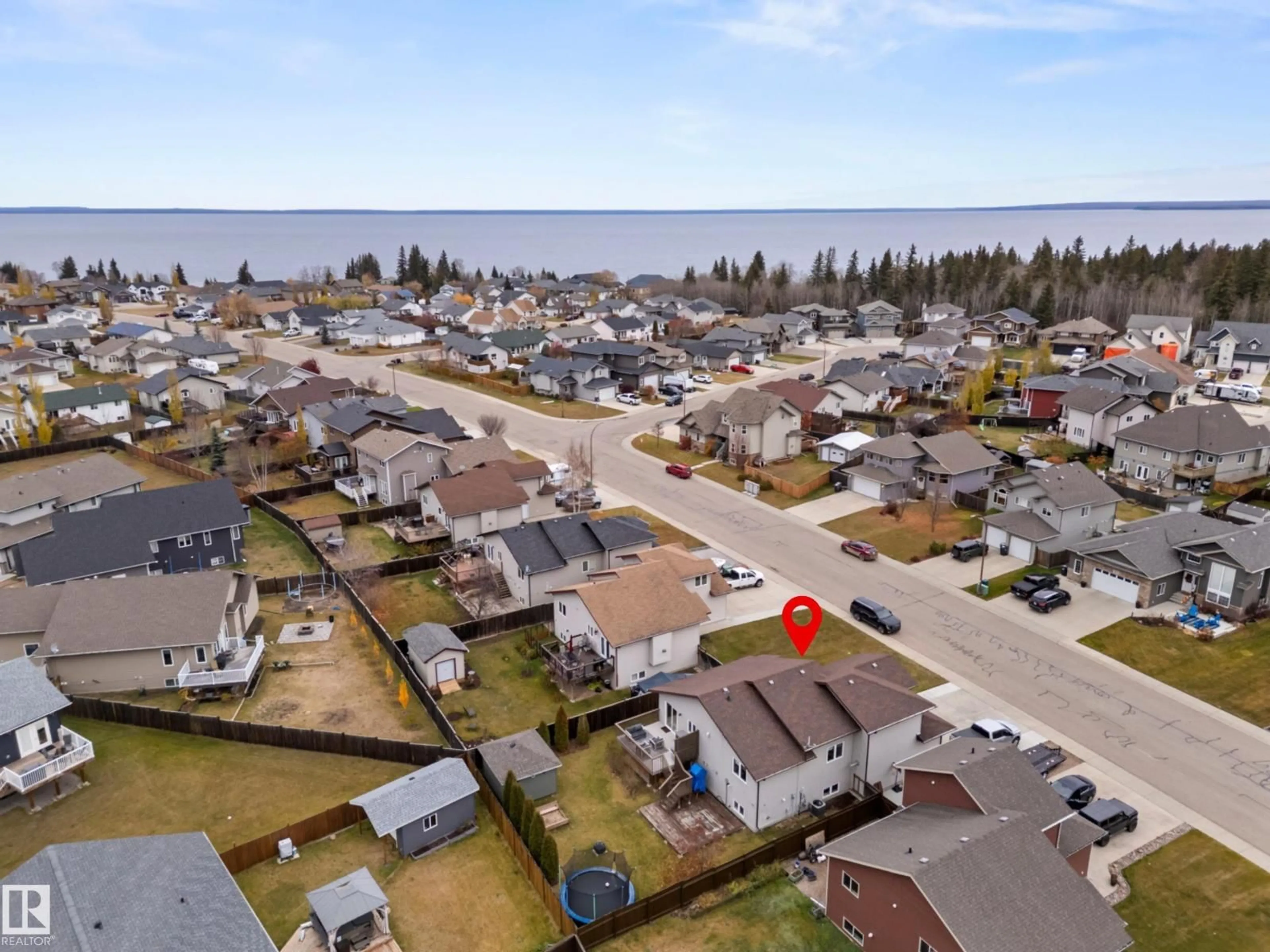 A pic from outside/outdoor area/front of a property/back of a property/a pic from drone, water/lake/river/ocean view for 506 26 ST, Cold Lake Alberta T9M0B2