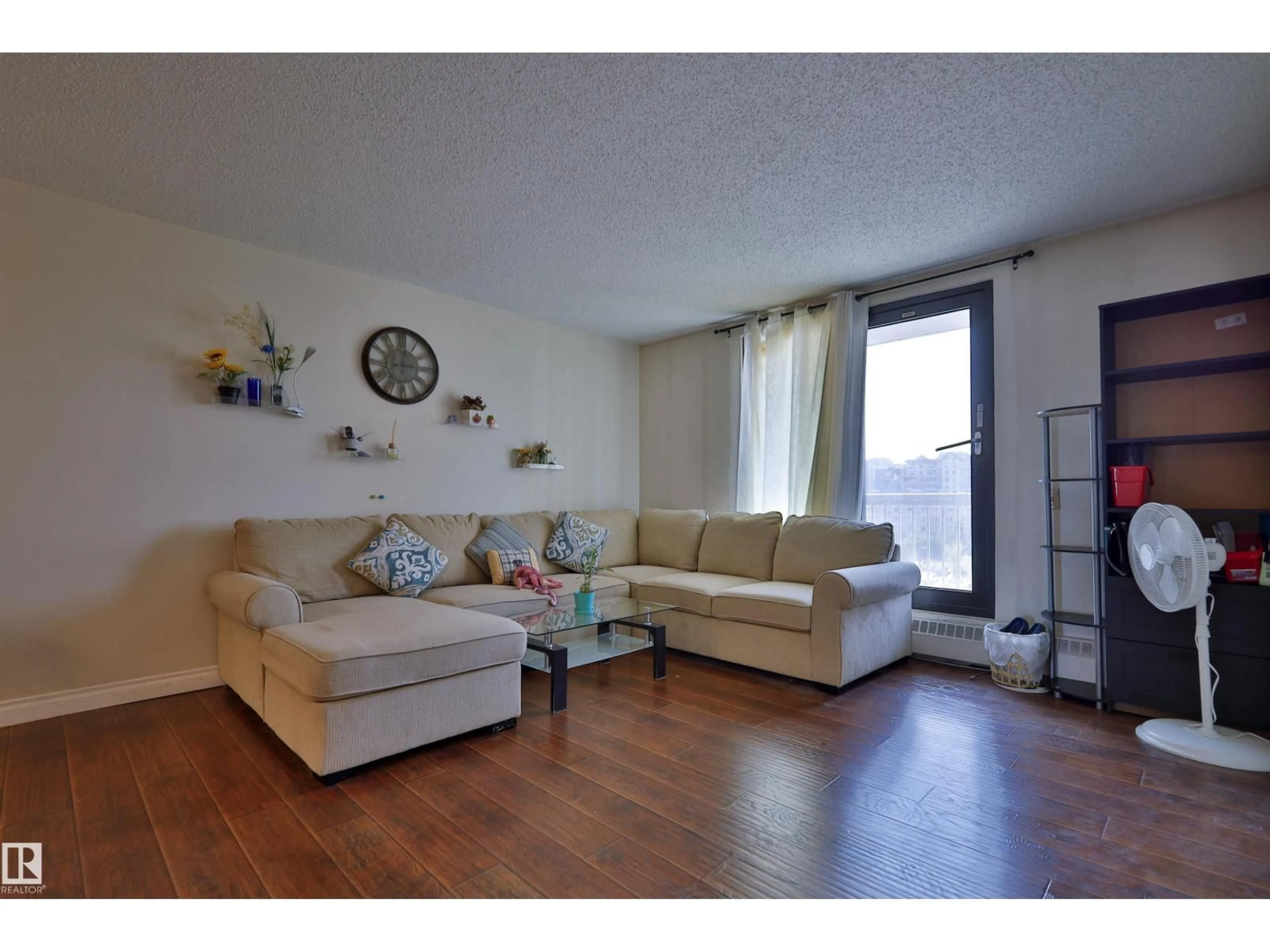 Living room with furniture, wood/laminate floor for 505 - 10175 109 ST, Edmonton Alberta T5J3P2