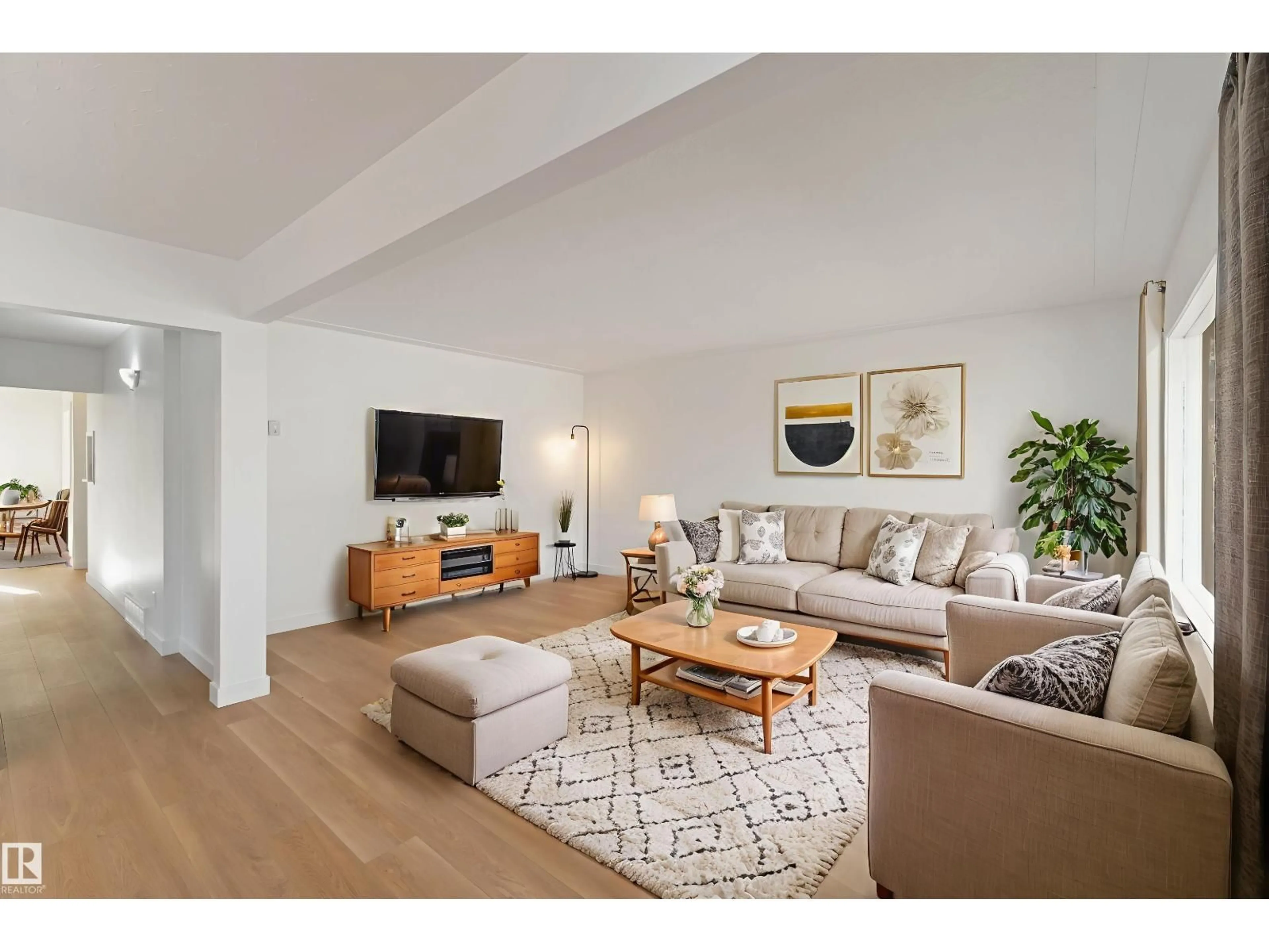 Living room with furniture, wood/laminate floor for 4503 46A AV, Leduc Alberta T9E5V5