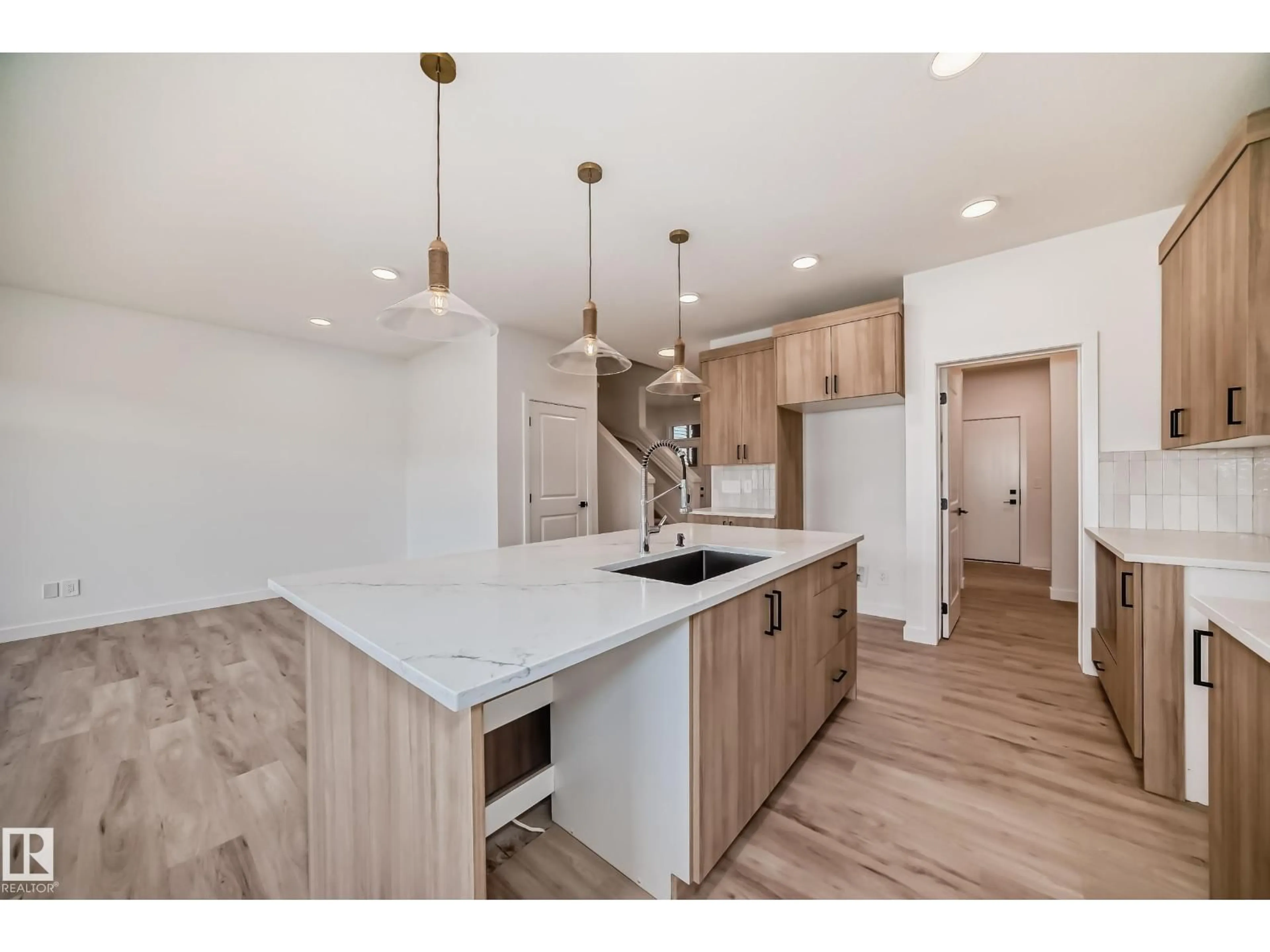 Open concept kitchen, wood/laminate floor for 20616 43 AV, Edmonton Alberta T6M3E3