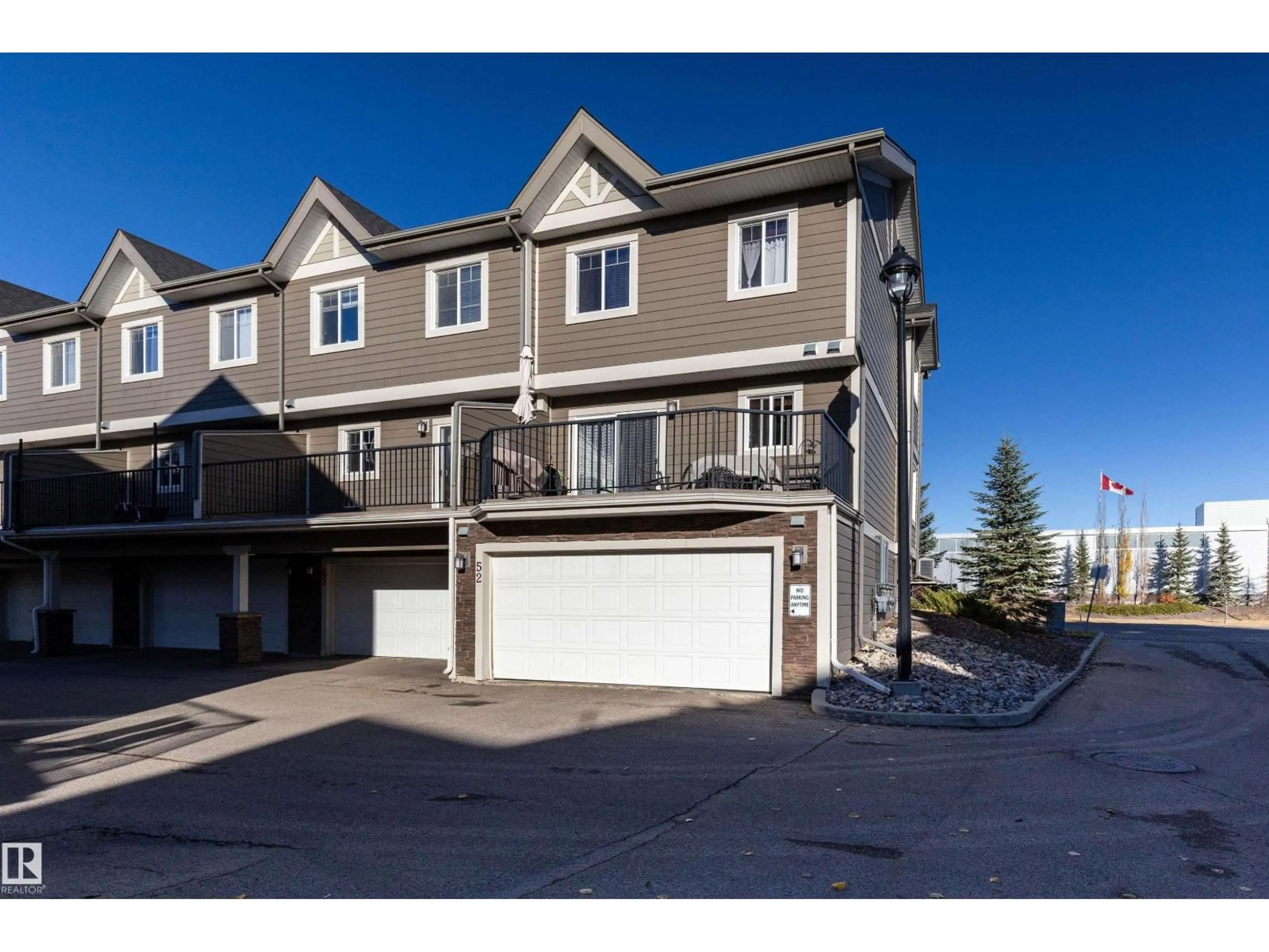 A pic from outside/outdoor area/front of a property/back of a property/a pic from drone, street for #52 - 1150 WINDERMERE WY, Edmonton Alberta T6W2B6