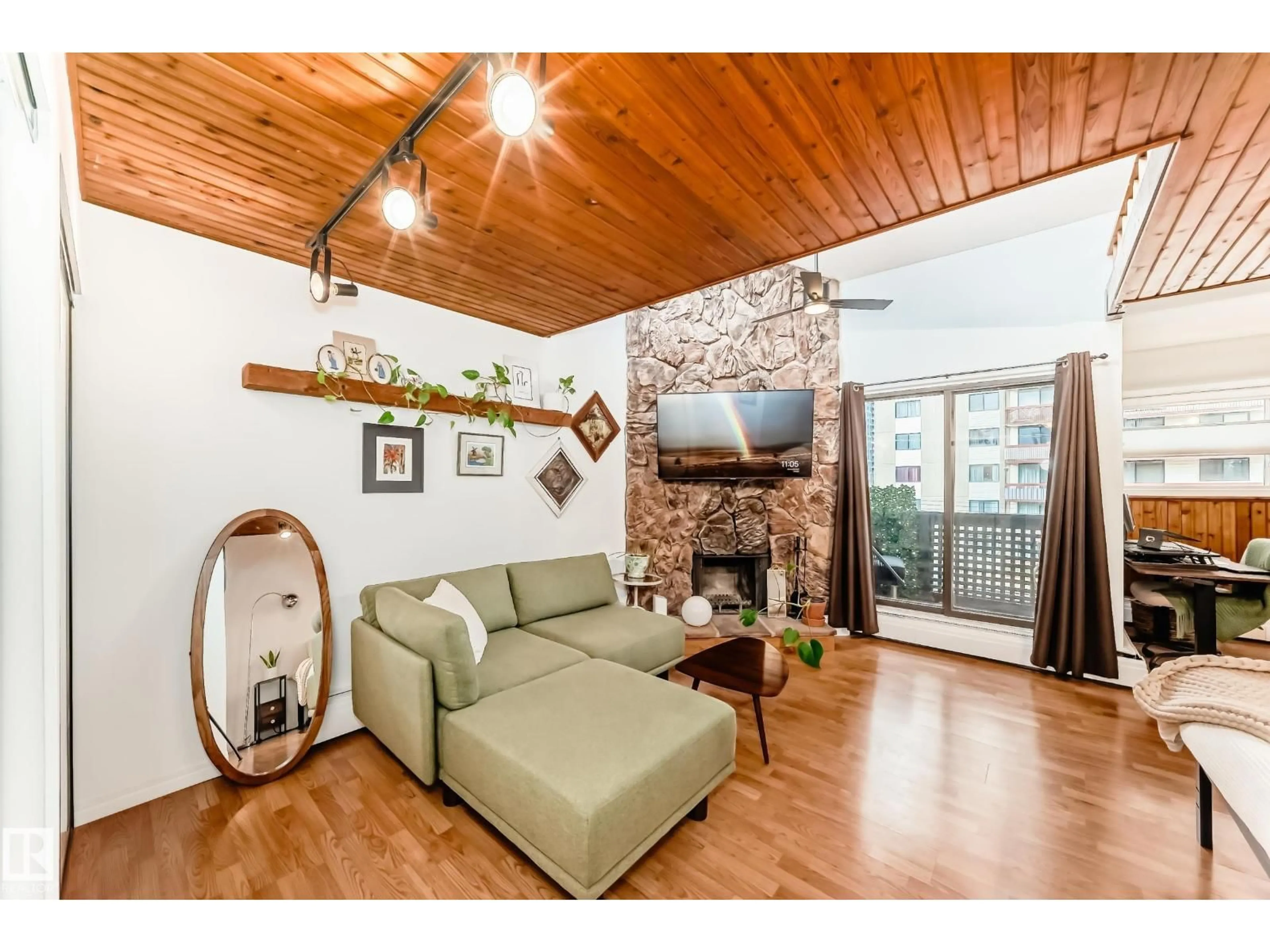 Living room with furniture, wood/laminate floor for 301 - 10148 118 ST, Edmonton Alberta T5K1Y4