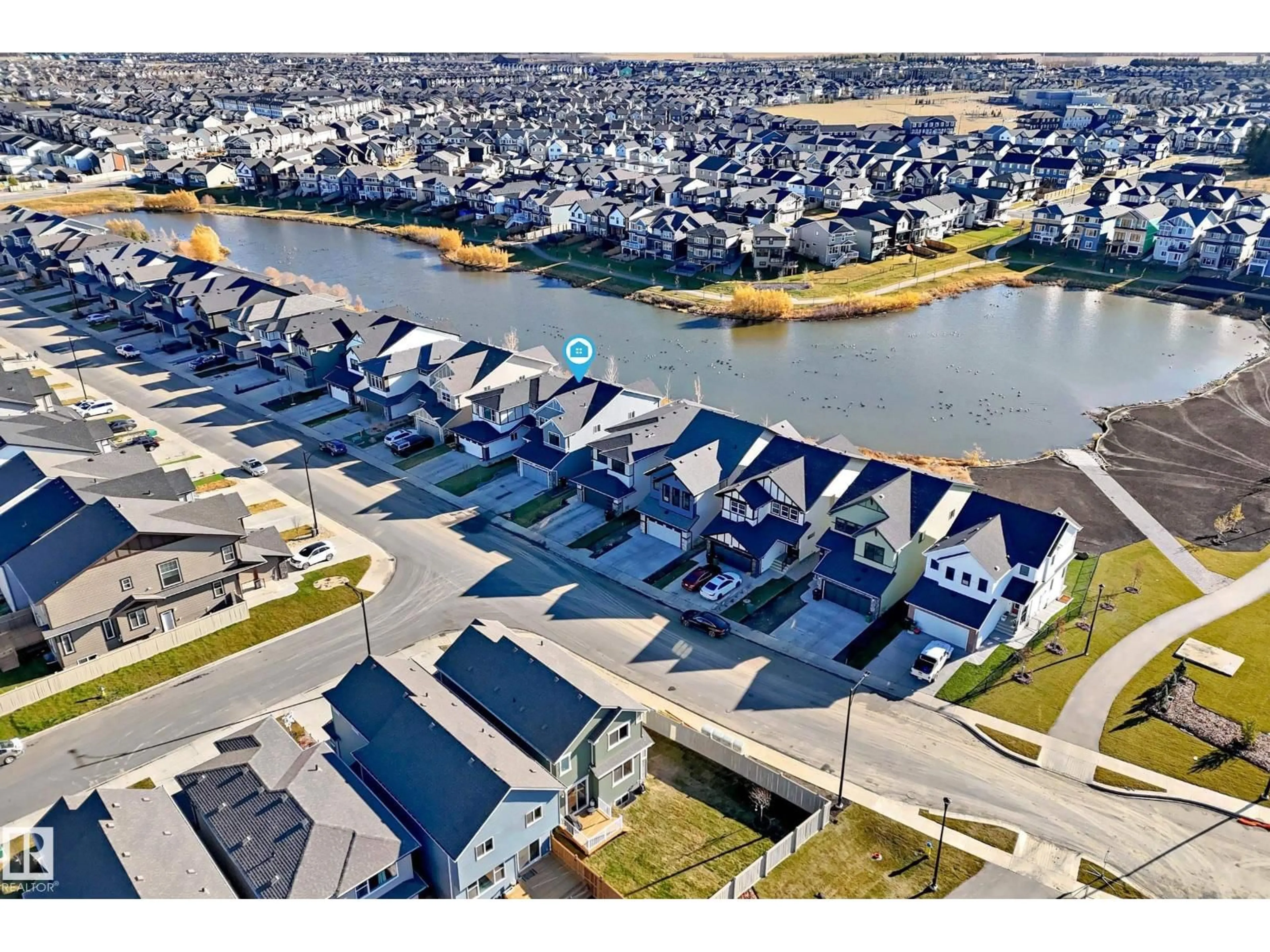 A pic from outside/outdoor area/front of a property/back of a property/a pic from drone, water/lake/river/ocean view for 3255 CHERNOWSKI WY, Edmonton Alberta T6W5H2