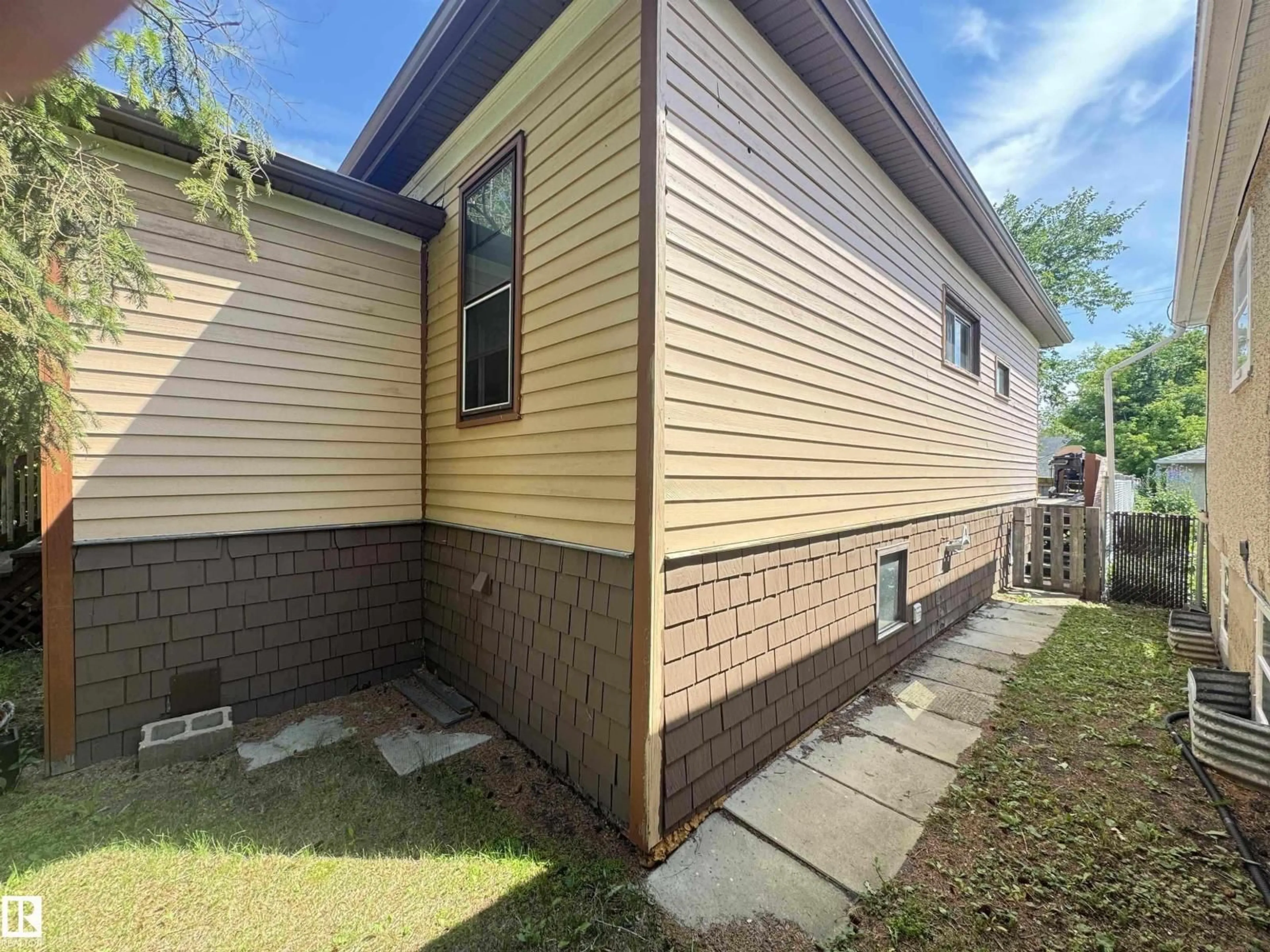 Home with vinyl exterior material, street for 10719 74 AV, Edmonton Alberta T6E1G7