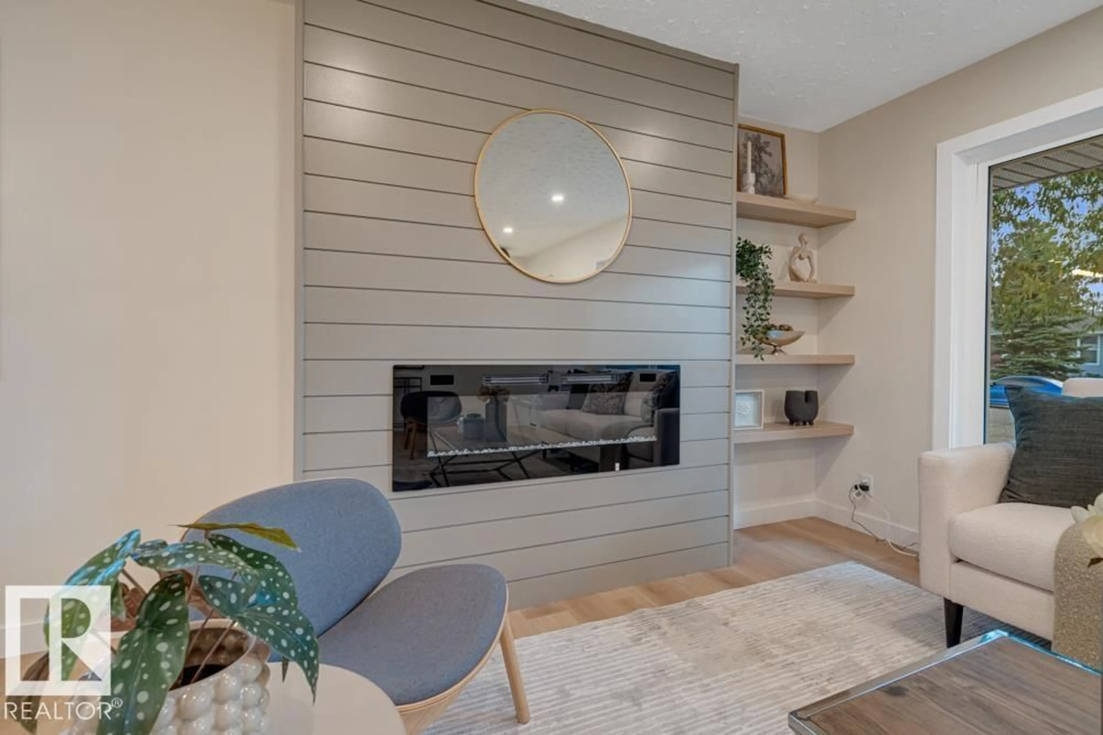 Living room with furniture, wood/laminate floor for 15022 86 AV, Edmonton Alberta T5R4C1