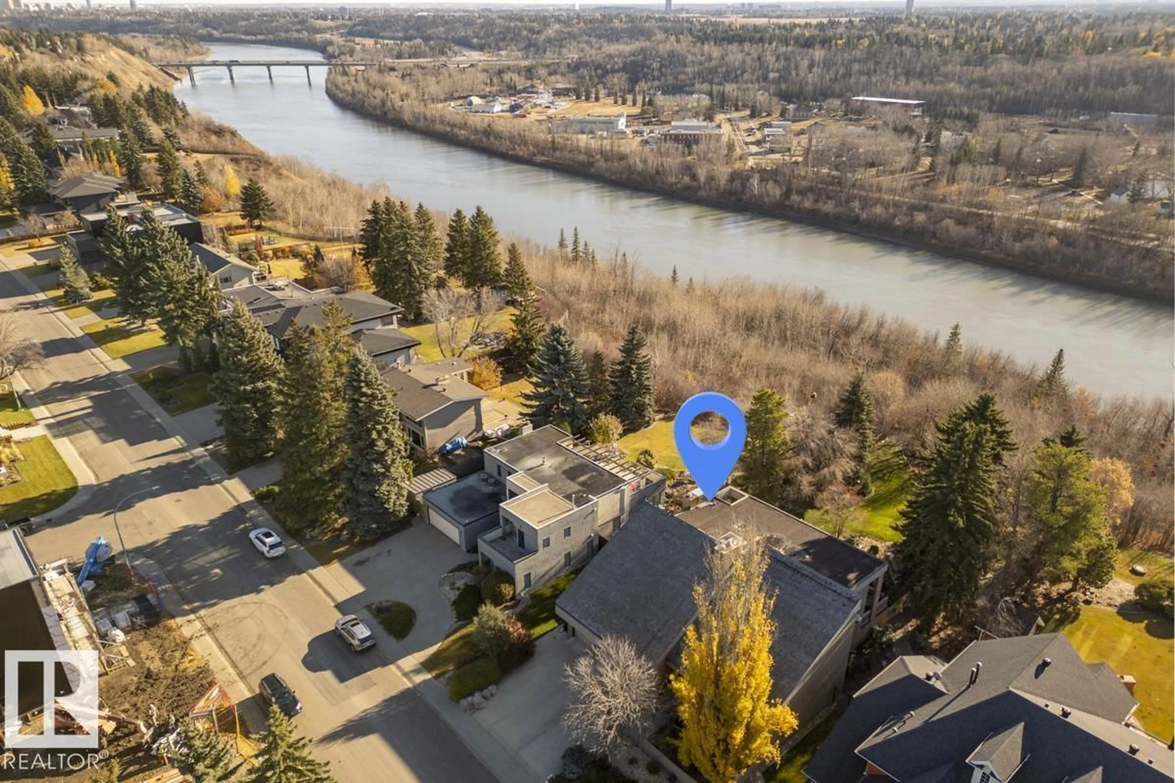 A pic from outside/outdoor area/front of a property/back of a property/a pic from drone, water/lake/river/ocean view for 15415 RIO TERRACE DR, Edmonton Alberta T5R3L1