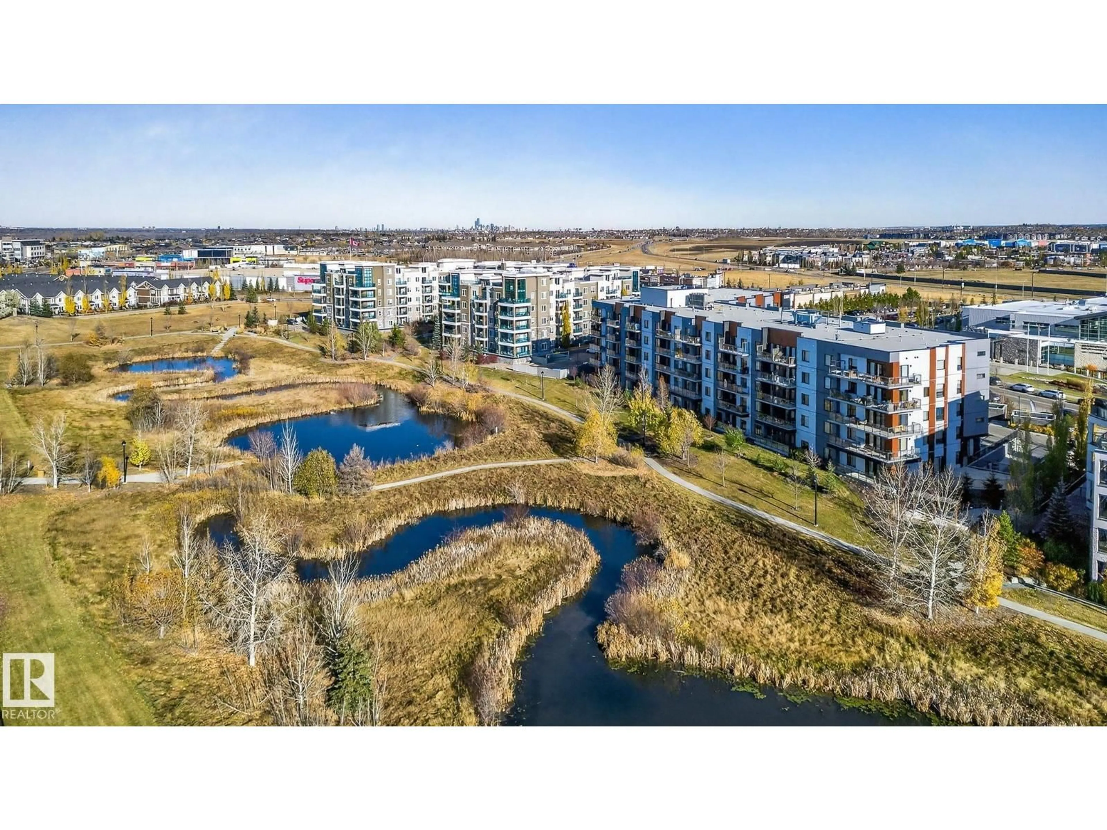 A pic from outside/outdoor area/front of a property/back of a property/a pic from drone, water/lake/river/ocean view for 1316 - 218 WINDERMERE WY, Edmonton Alberta T6W2J3