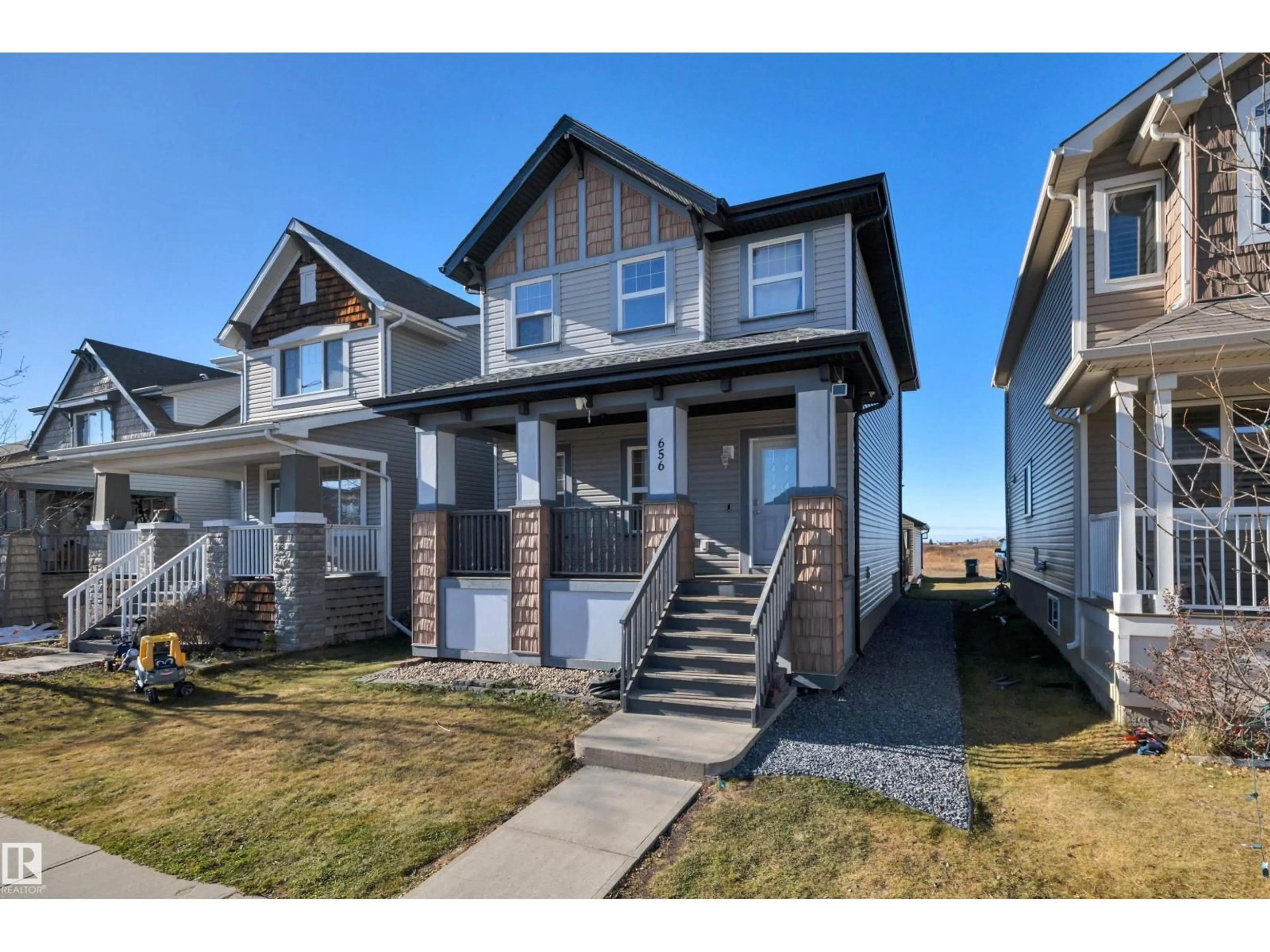 Home with vinyl exterior material, street for 656 SONGHURST WD, Leduc Alberta T9E0R1