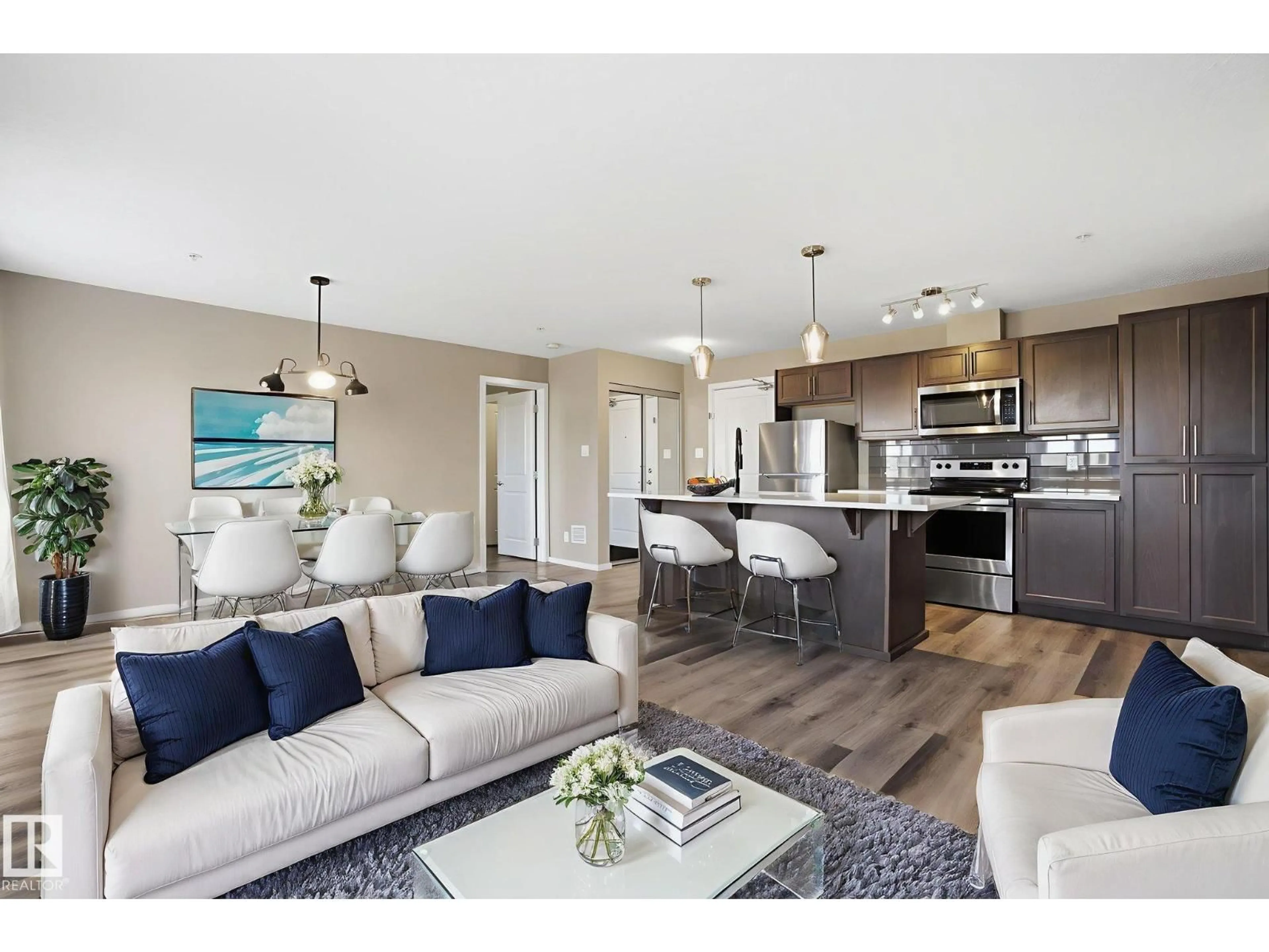 Open concept kitchen, wood/laminate floor for 148 - 126 EBBERS BV, Edmonton Alberta T5Y3W2