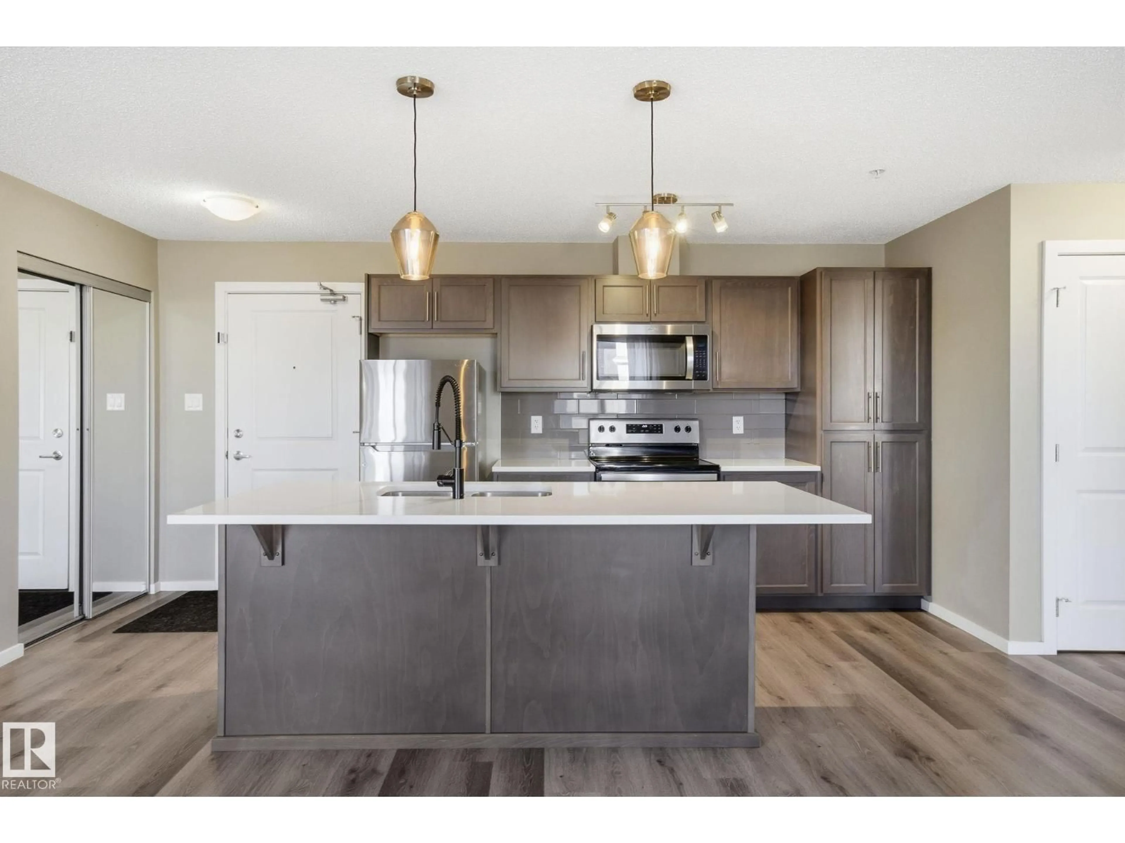 Open concept kitchen, unknown for 148 - 126 EBBERS BV, Edmonton Alberta T5Y3W2