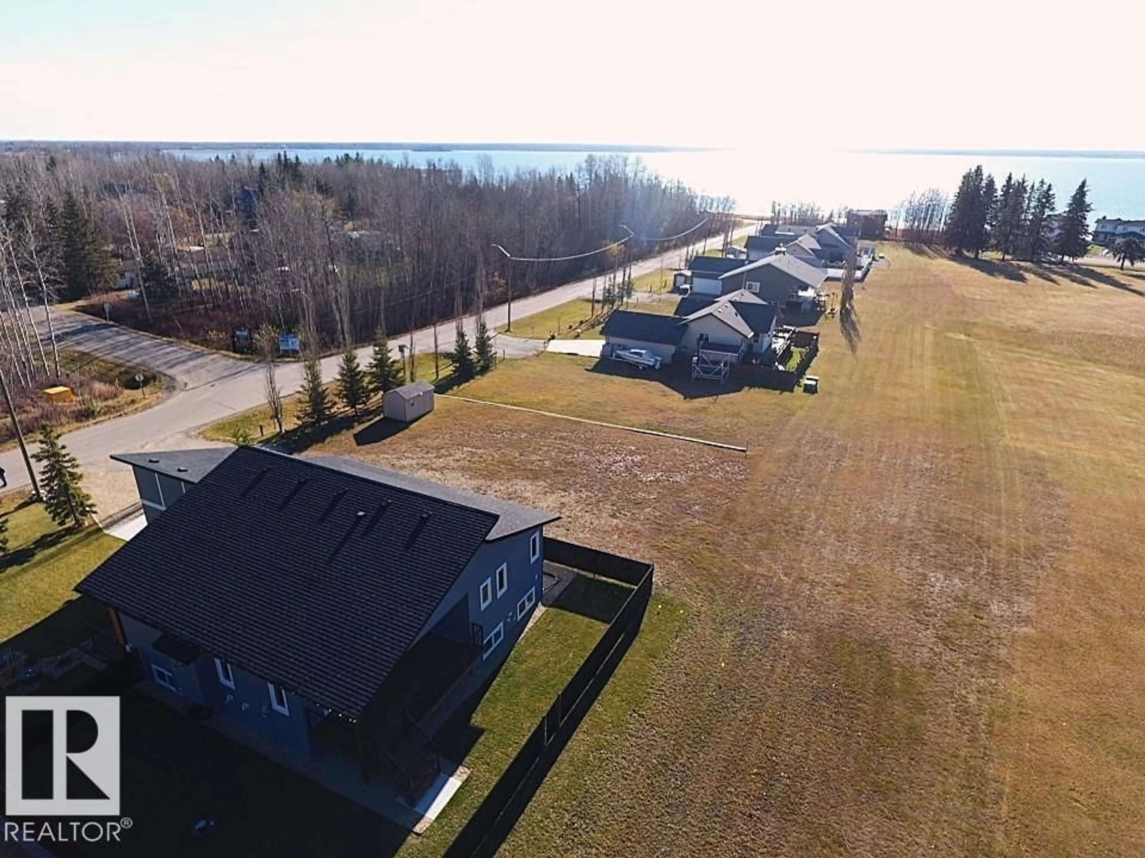 A pic from outside/outdoor area/front of a property/back of a property/a pic from drone, water/lake/river/ocean view for 102 1 STREET, Rural Lac Ste. Anne County Alberta T0E1A0