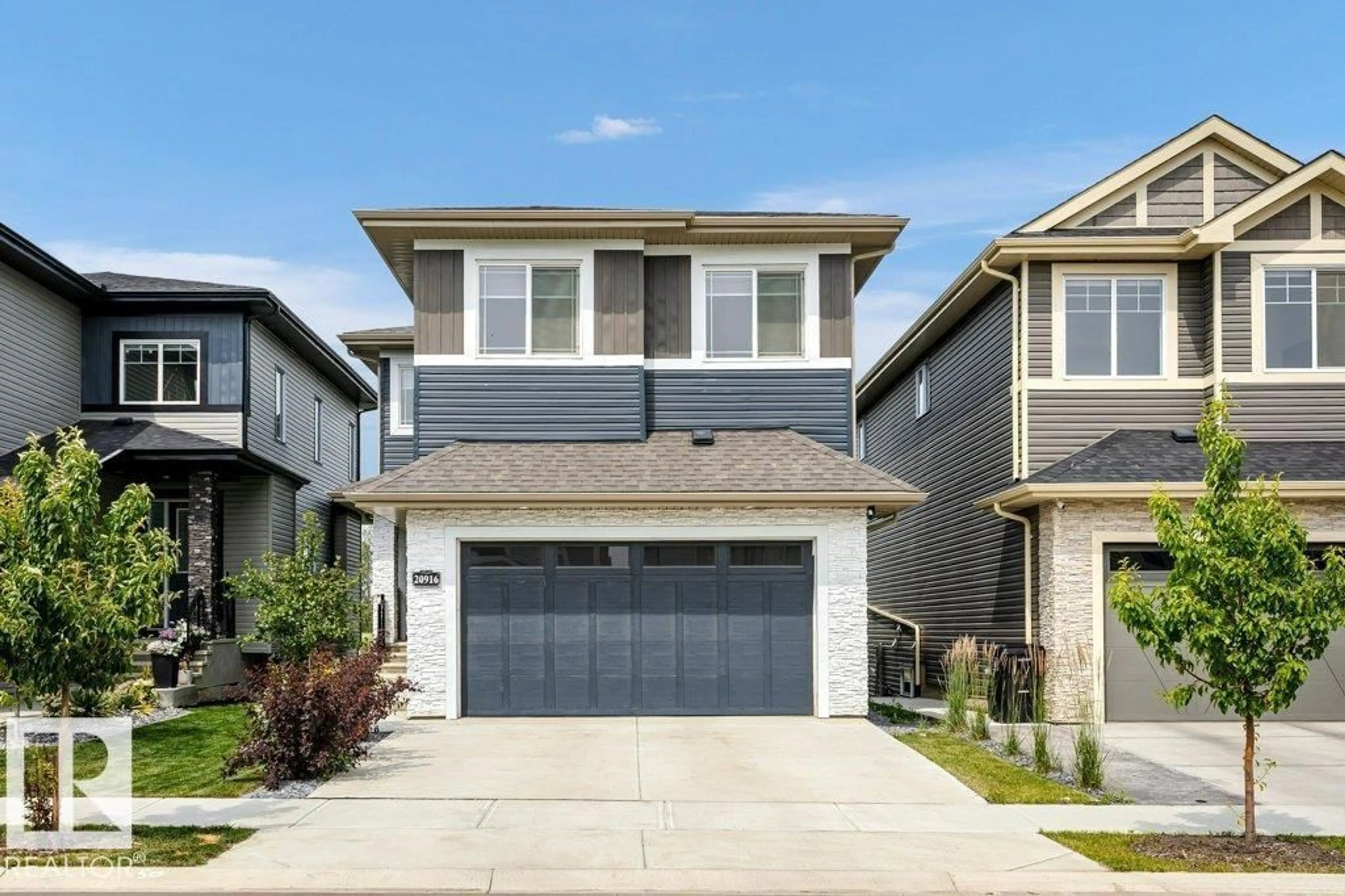 Home with vinyl exterior material, street for 20916 131 AV, Edmonton Alberta T5S0P4