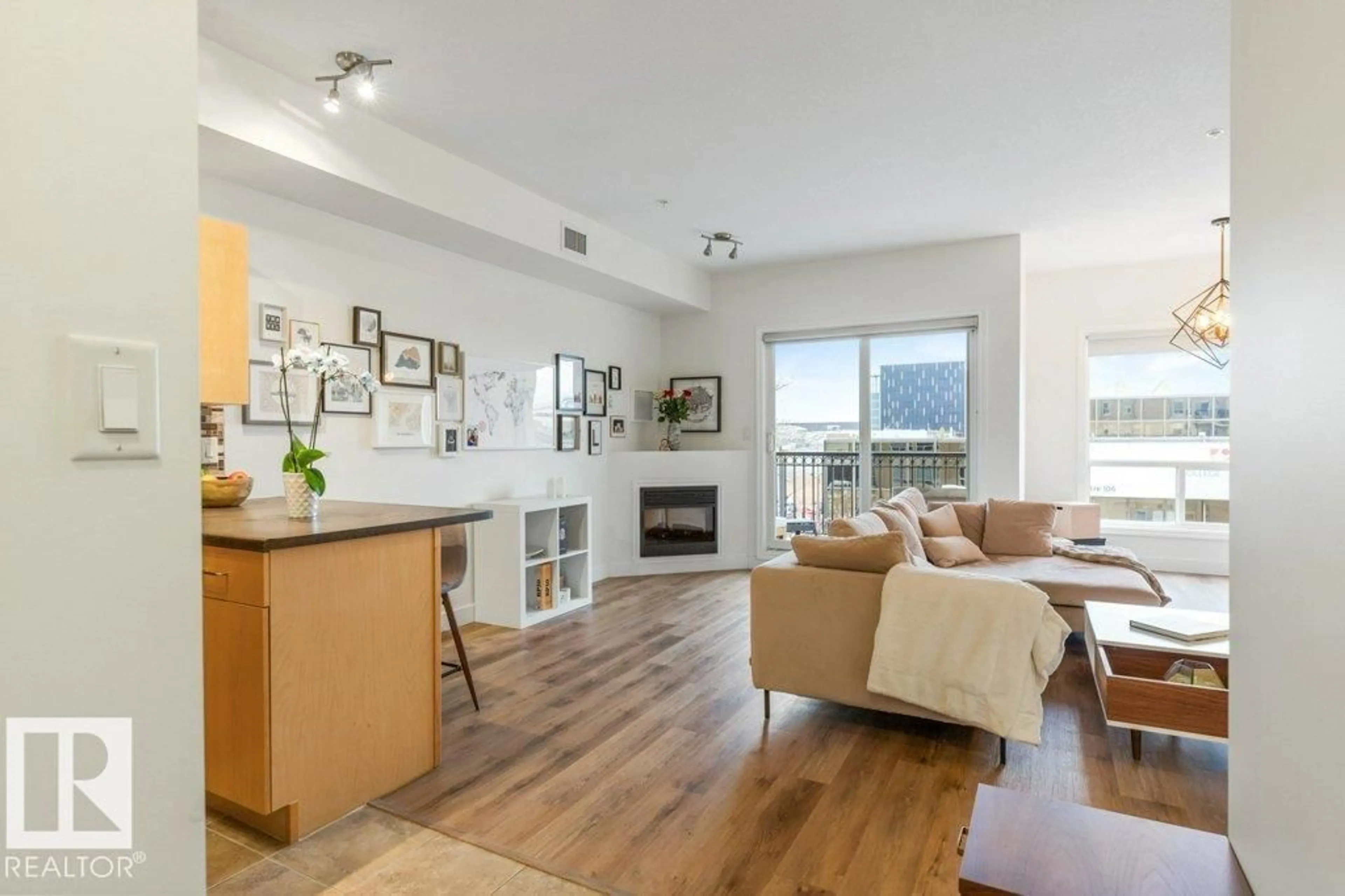 Living room with furniture, wood/laminate floor for #405 - 10606 102 AV, Edmonton Alberta T5J5E9