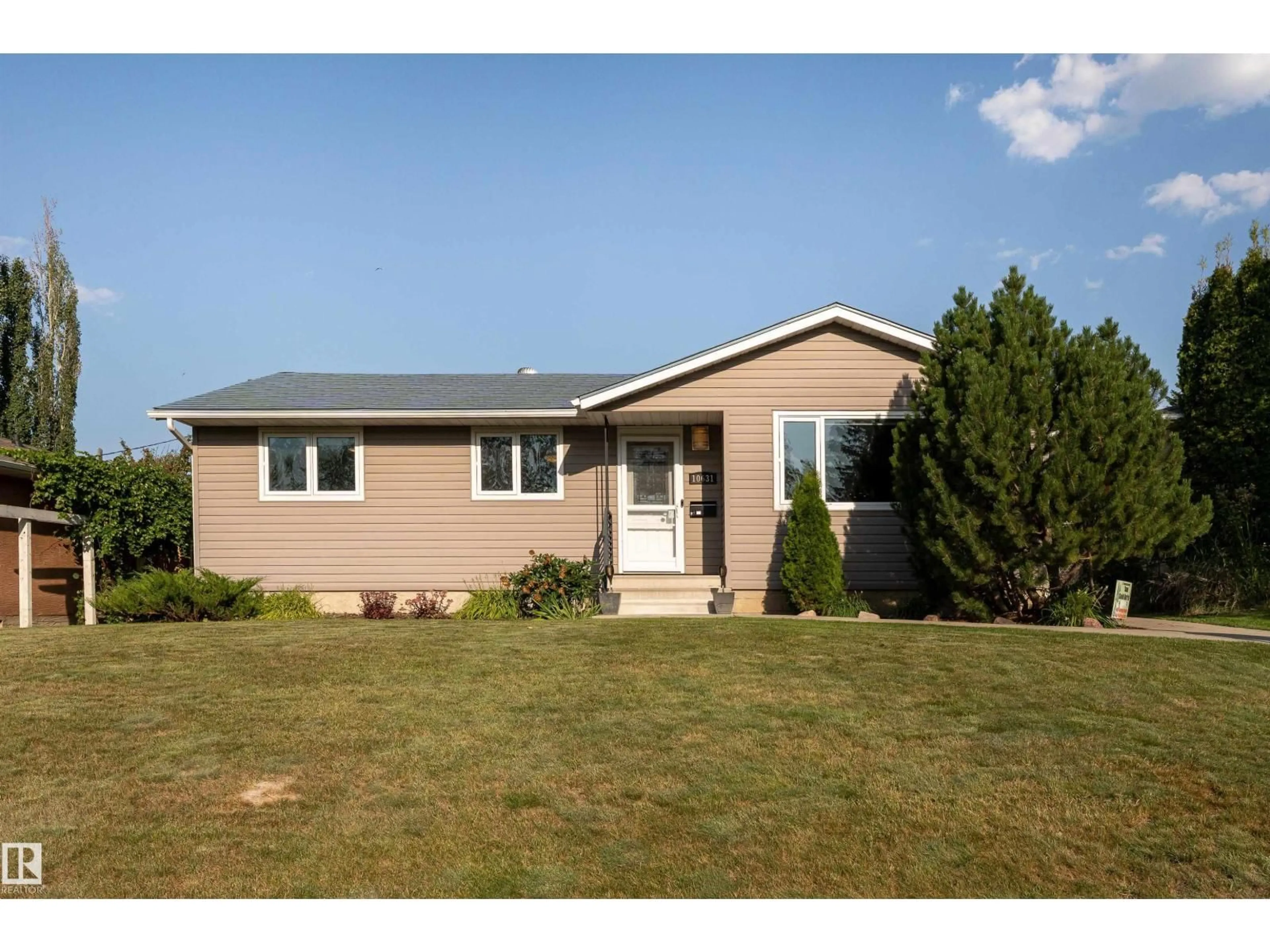 Home with vinyl exterior material, street for 10631 43 ST, Edmonton Alberta T6A1V2