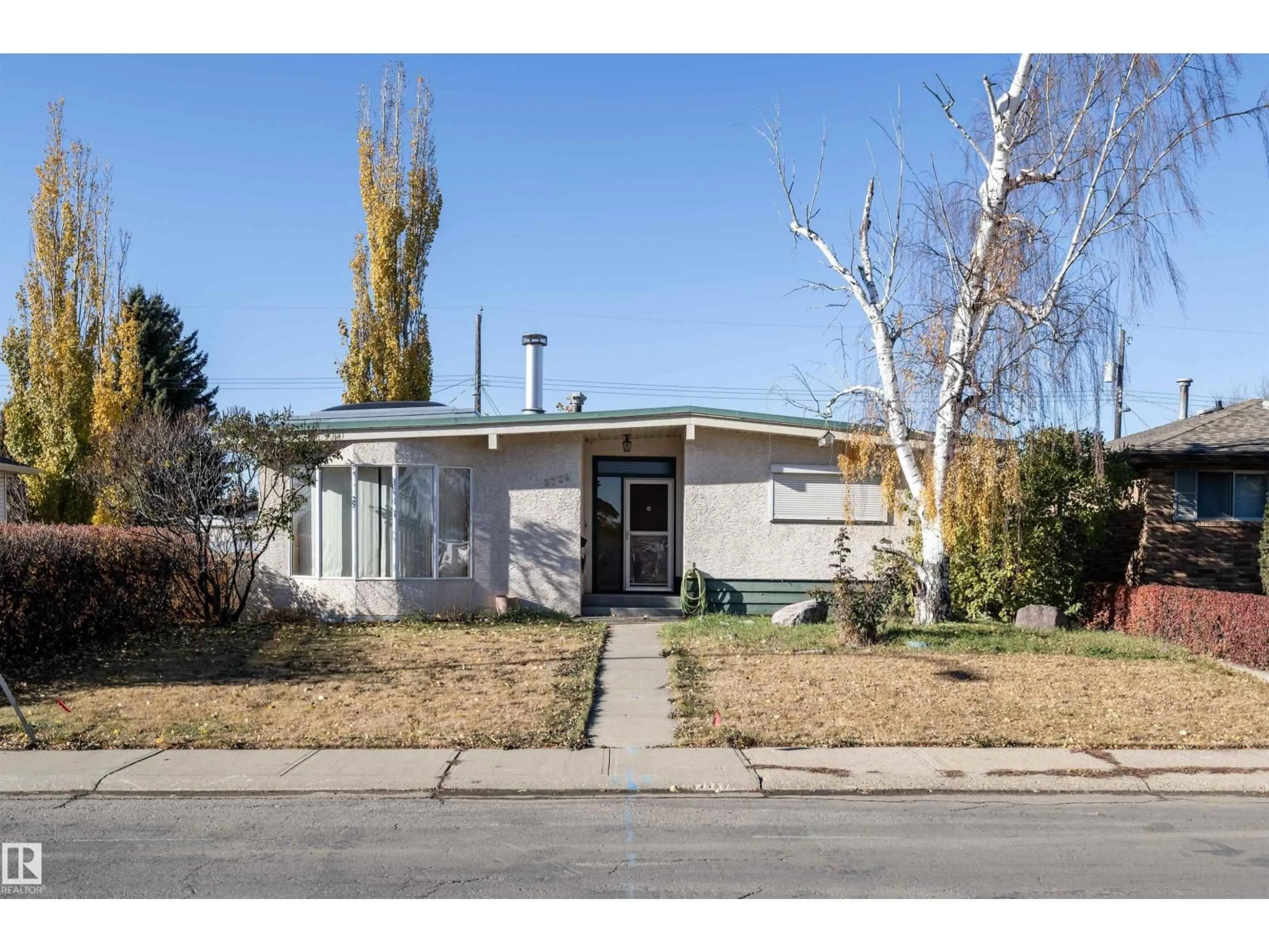 Home with vinyl exterior material, street for 8728 72 ST NW, Edmonton Alberta T6B1Y5