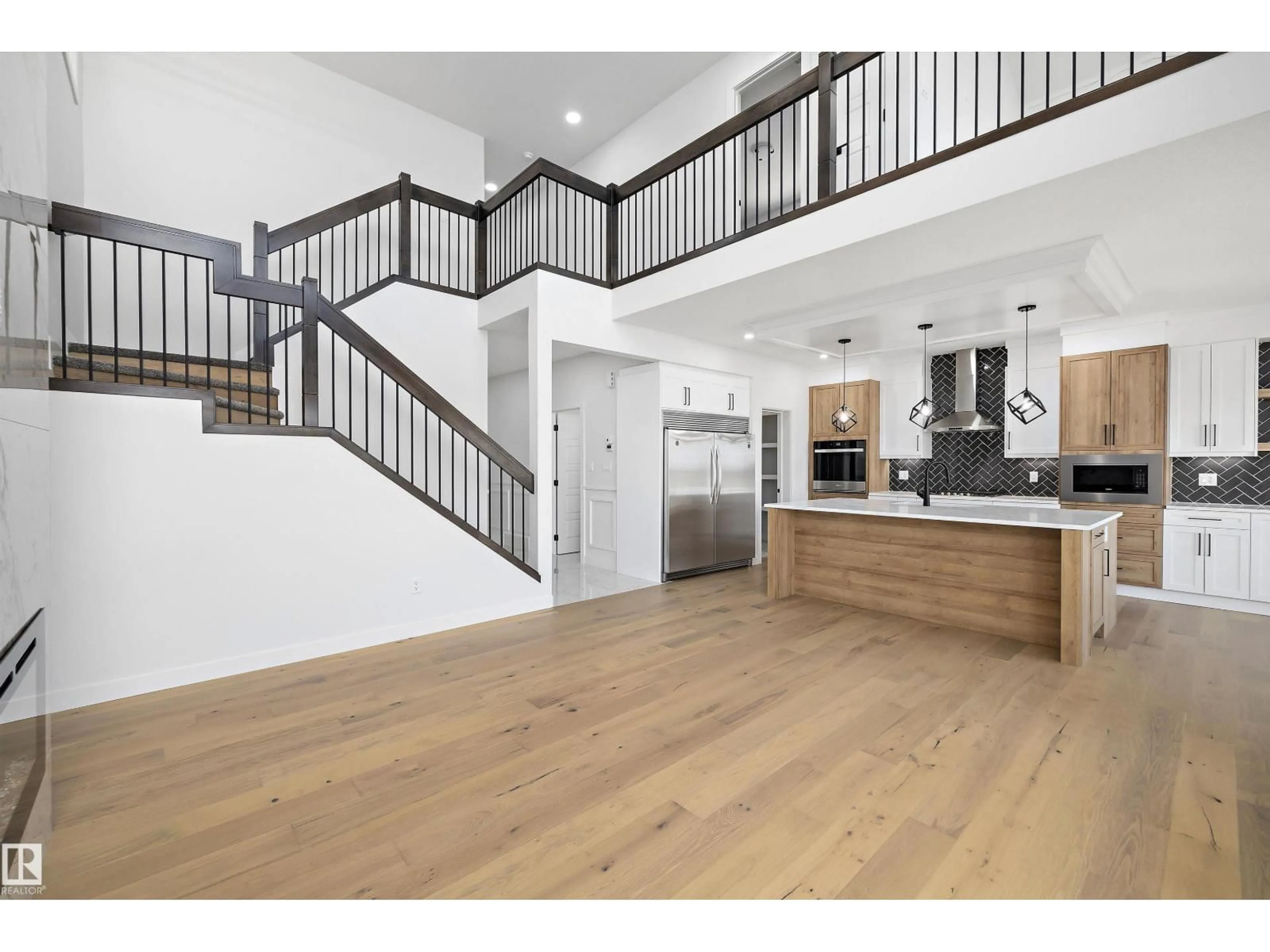 Open concept kitchen, wood/laminate floor for 234 KINGLET BV, Edmonton Alberta T5S0W4