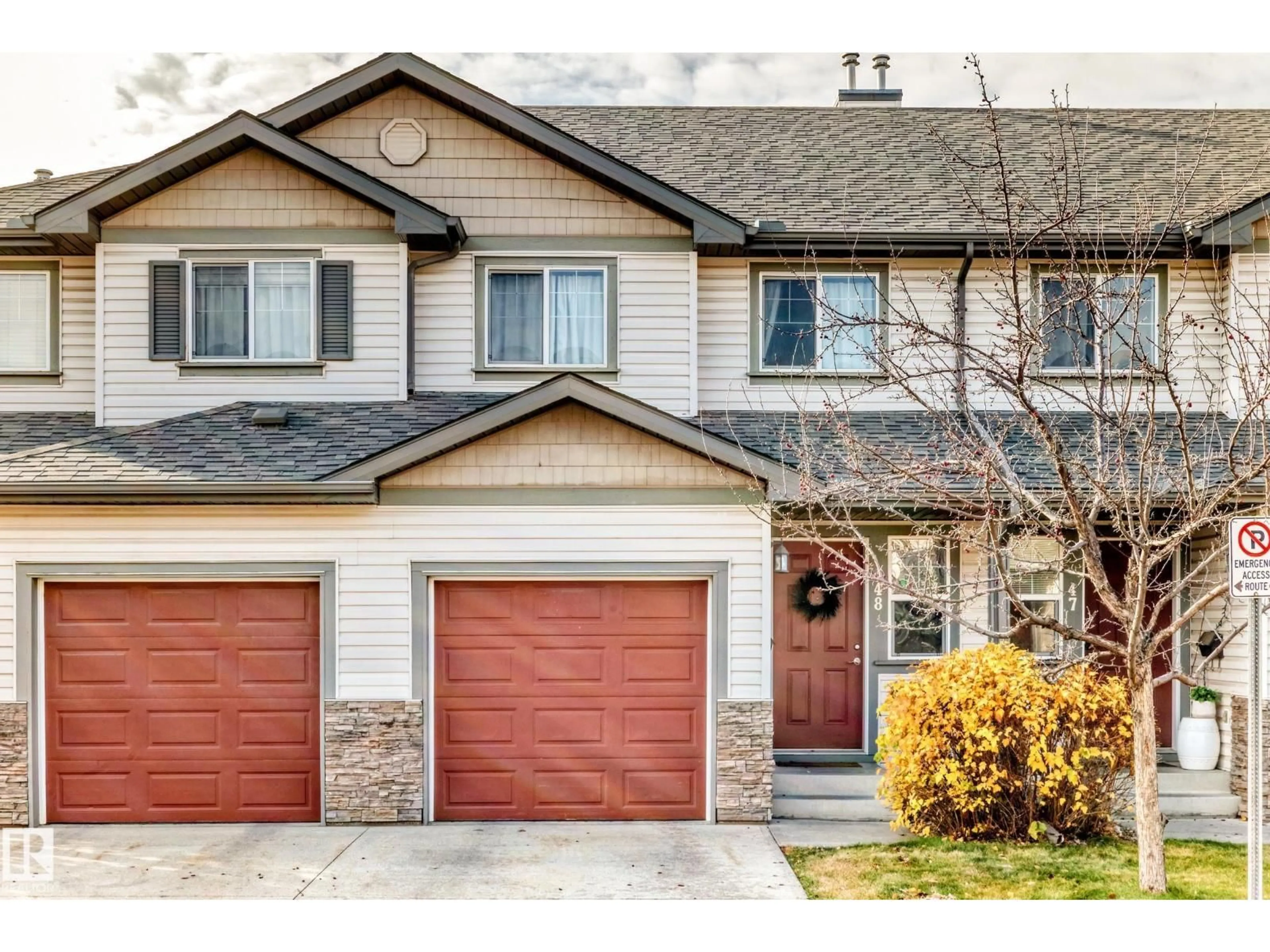 Home with vinyl exterior material, street for 48 2816 34 AV NW, Edmonton Alberta T6T2B4