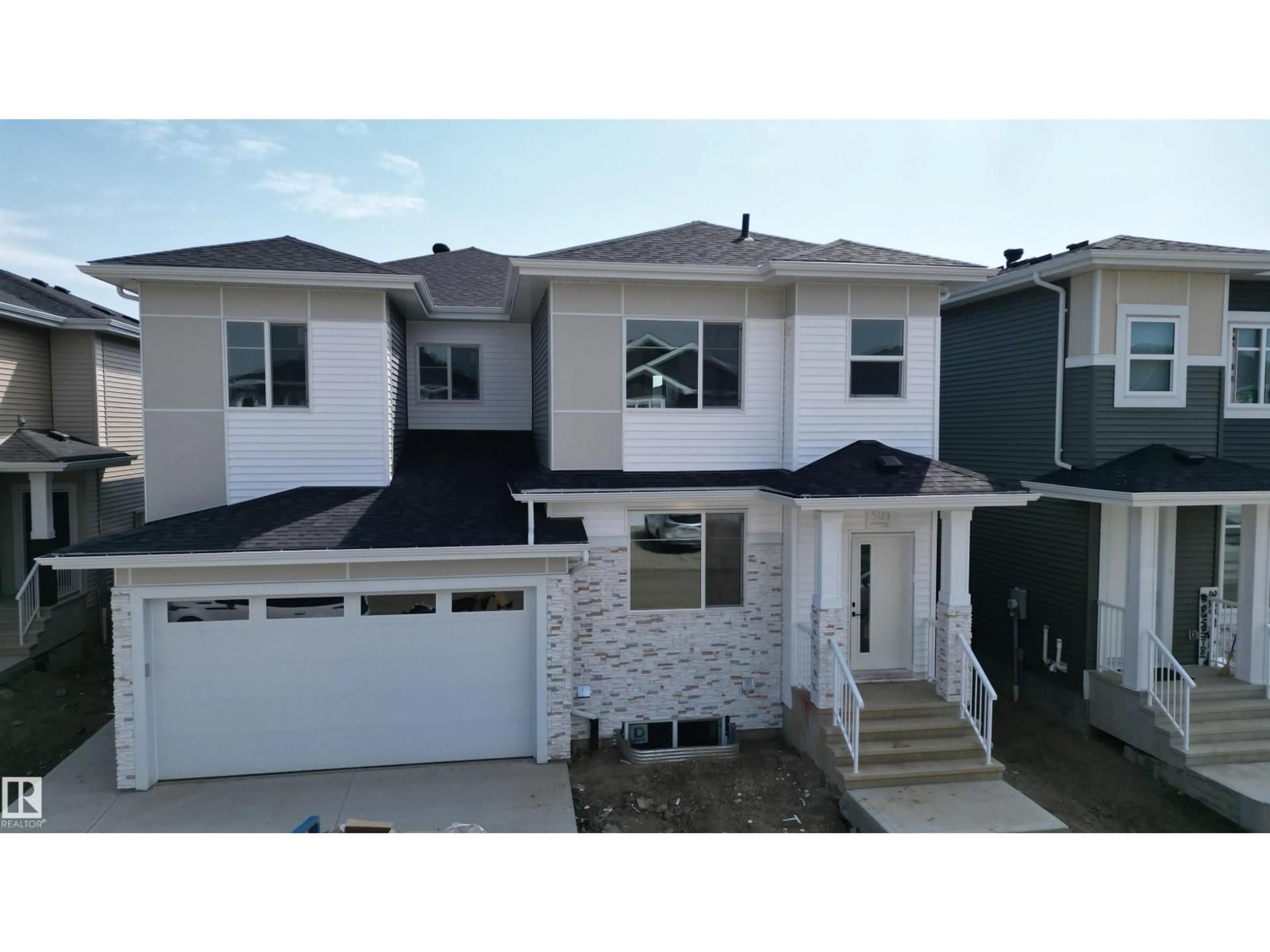 Home with vinyl exterior material, street for 3127 MAGPIE WY, Edmonton Alberta T5S0V3