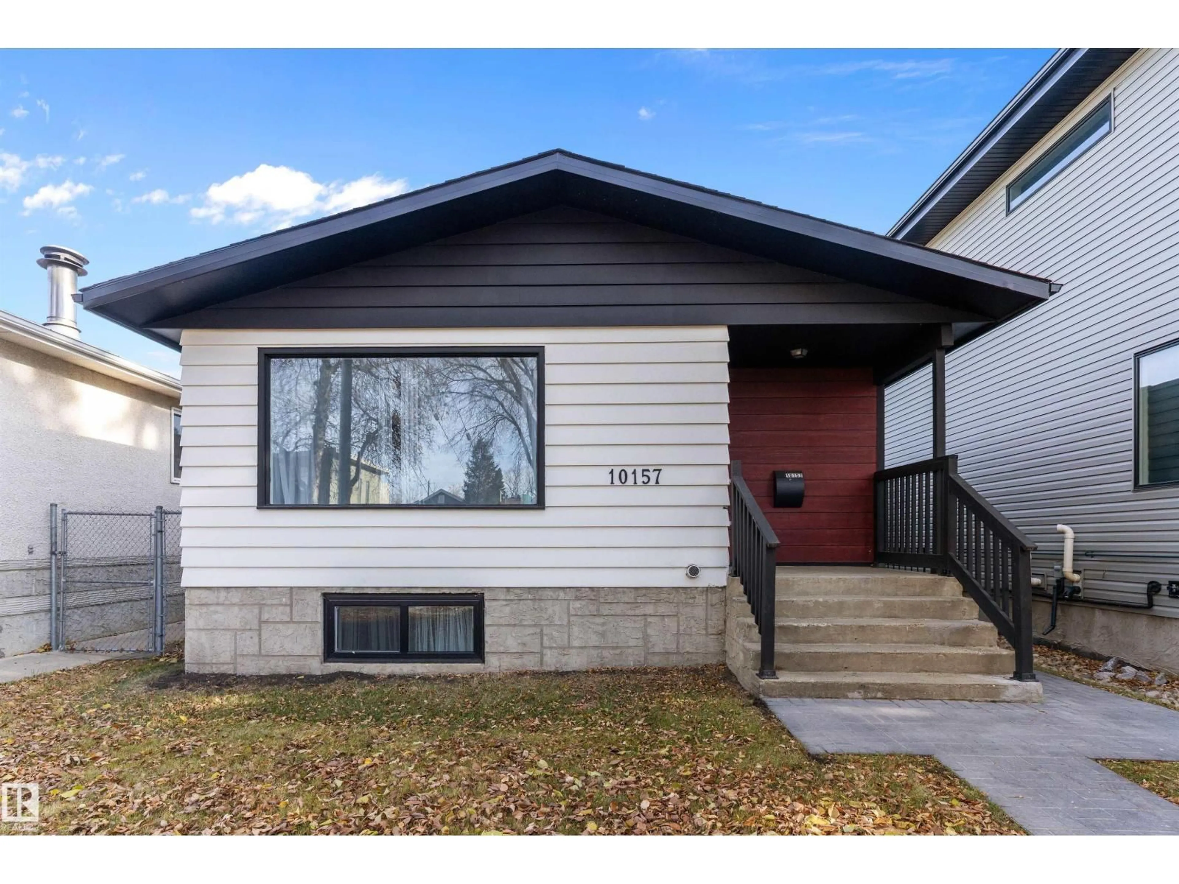 Home with vinyl exterior material, street for 10157 145 ST, Edmonton Alberta T5N2X6