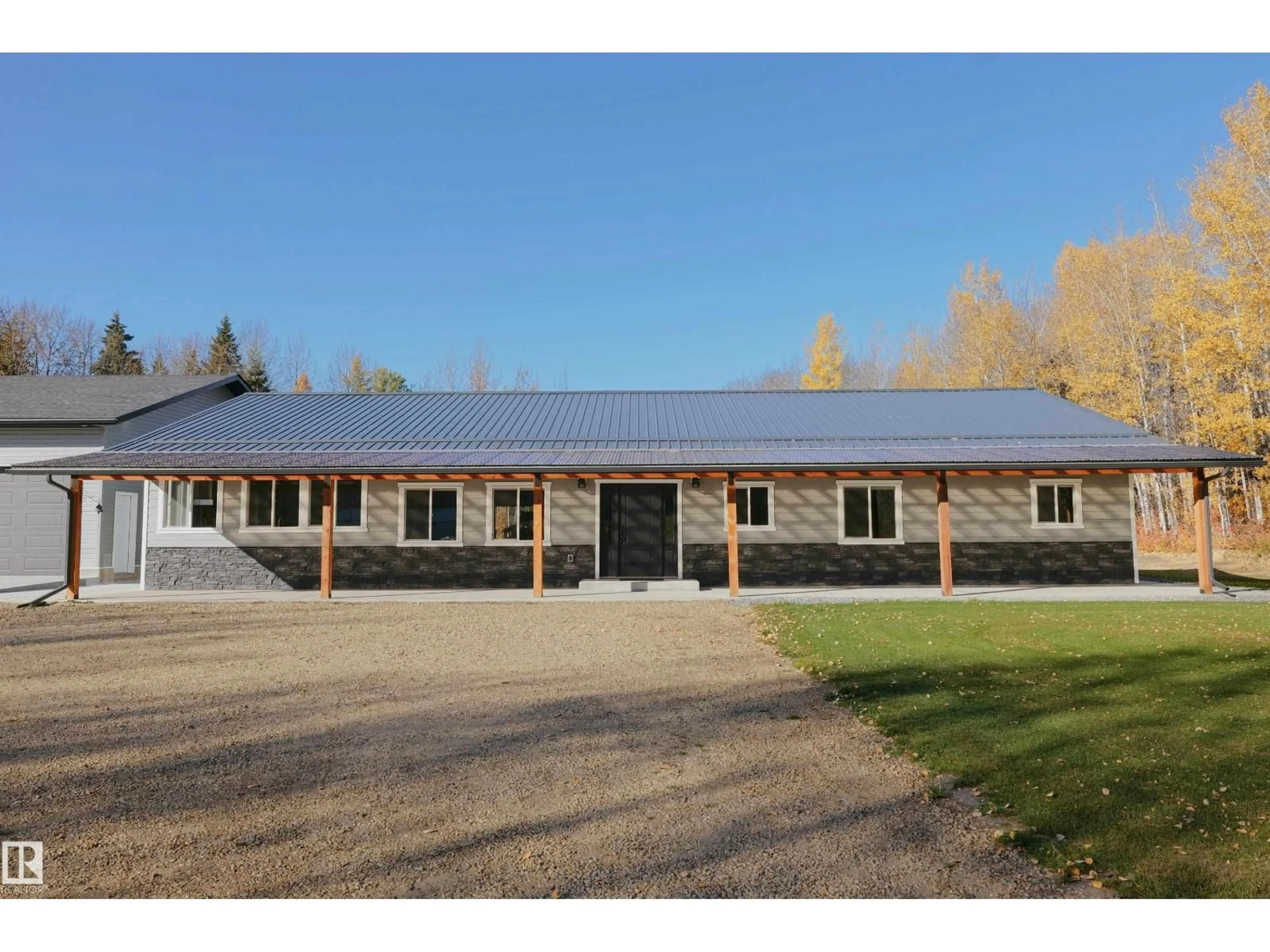 A pic from outside/outdoor area/front of a property/back of a property/a pic from drone, building for 60432 RGE RD 64, Rural Barrhead County Alberta T7N1N3