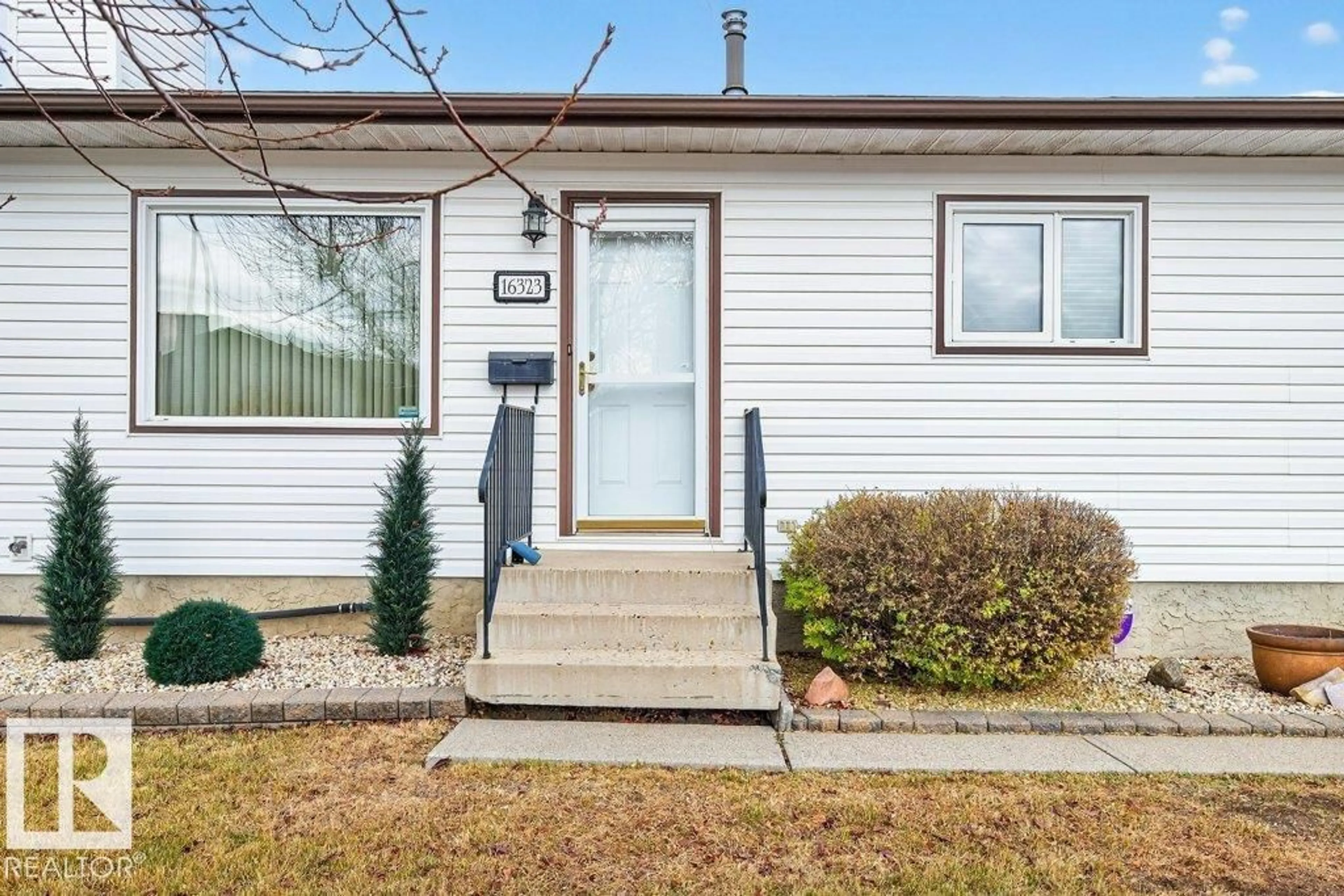 Home with vinyl exterior material, street for NW NW - 16323 99 ST, Edmonton Alberta T5X5J1