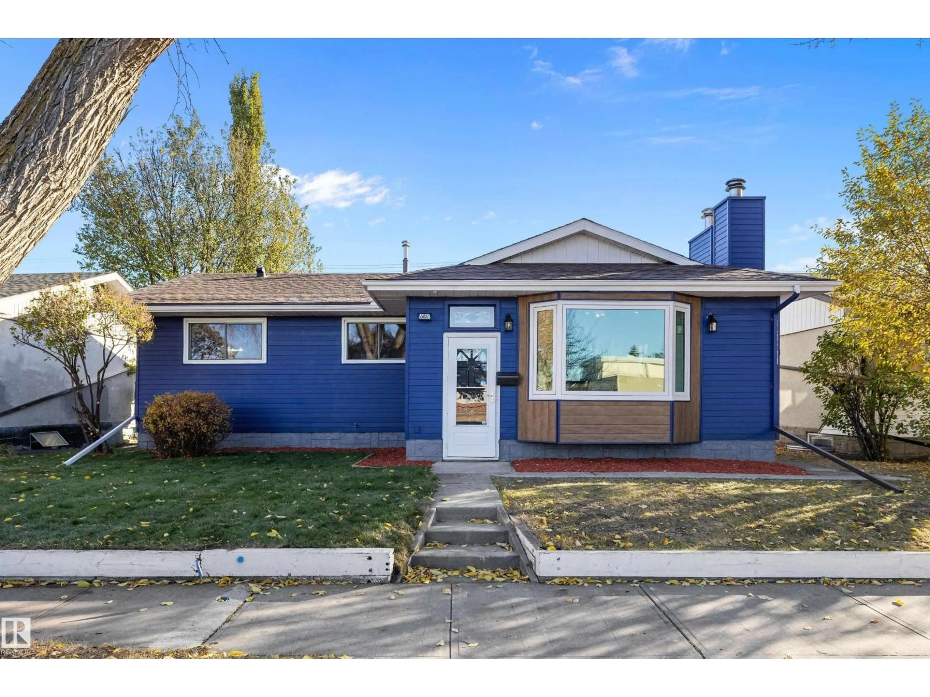 Home with vinyl exterior material, street for NW - 11031 153A ST, Edmonton Alberta T5P2E7