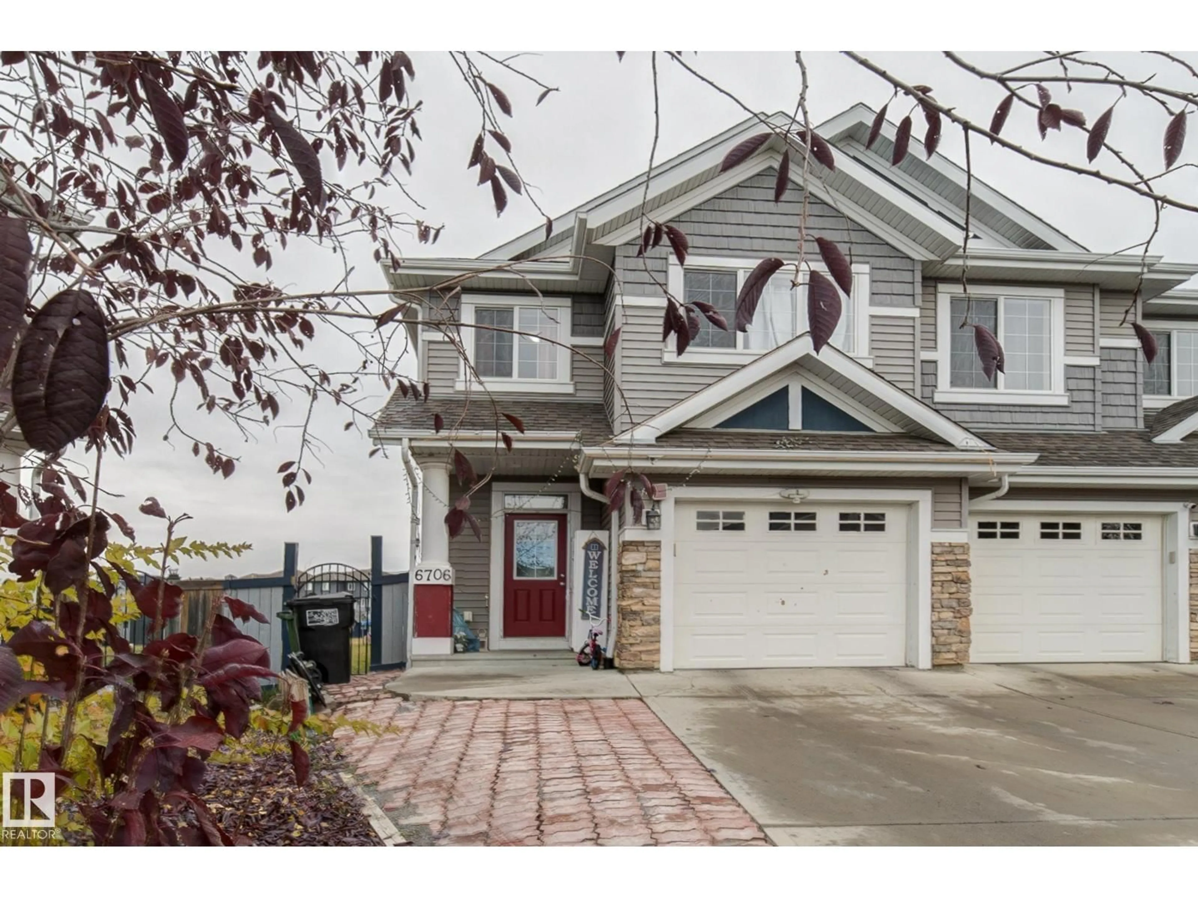 Home with vinyl exterior material, street for 6706 24 AV, Edmonton Alberta T6X2A9