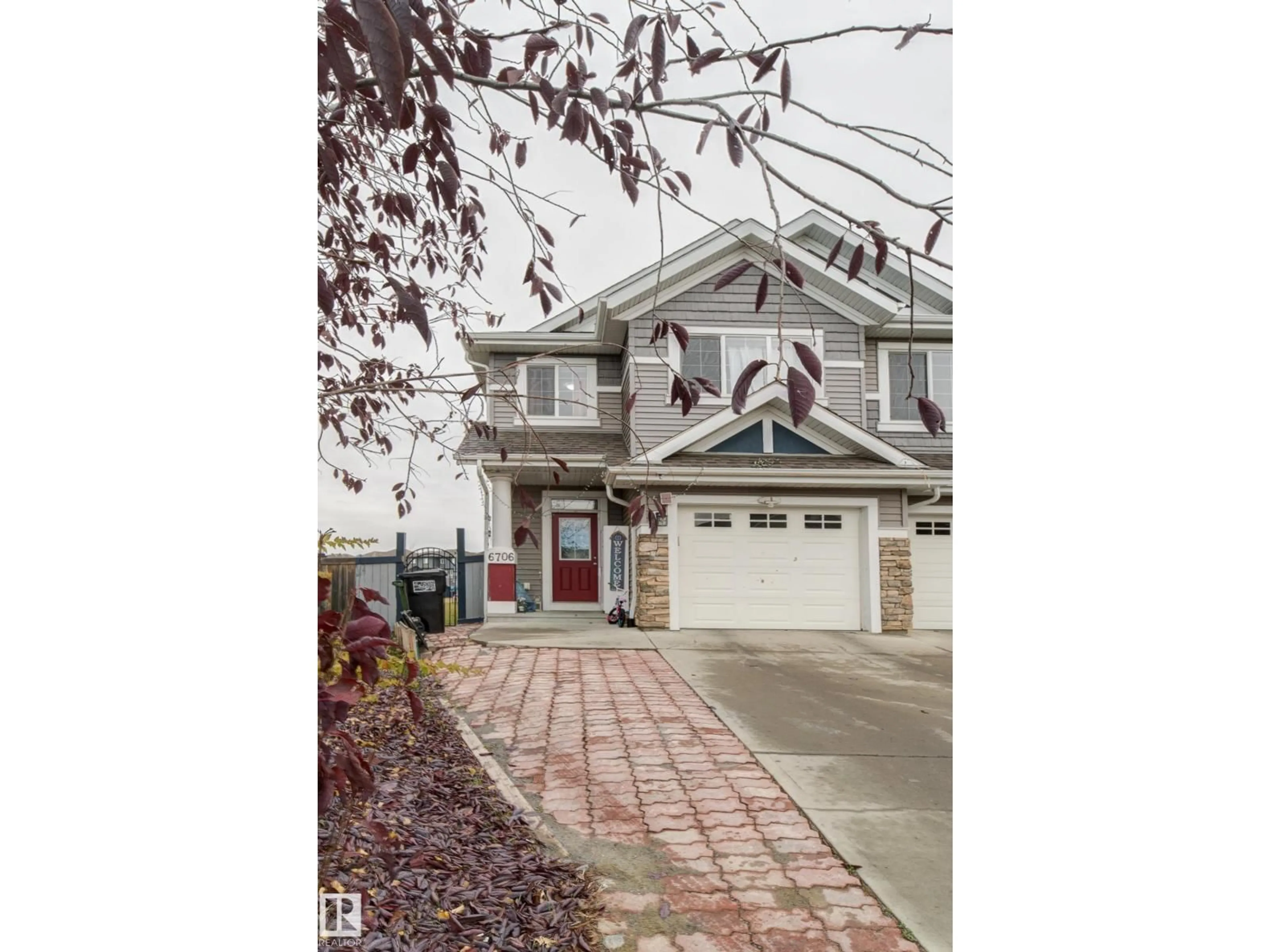 Home with vinyl exterior material, street for 6706 24 AV, Edmonton Alberta T6X2A9