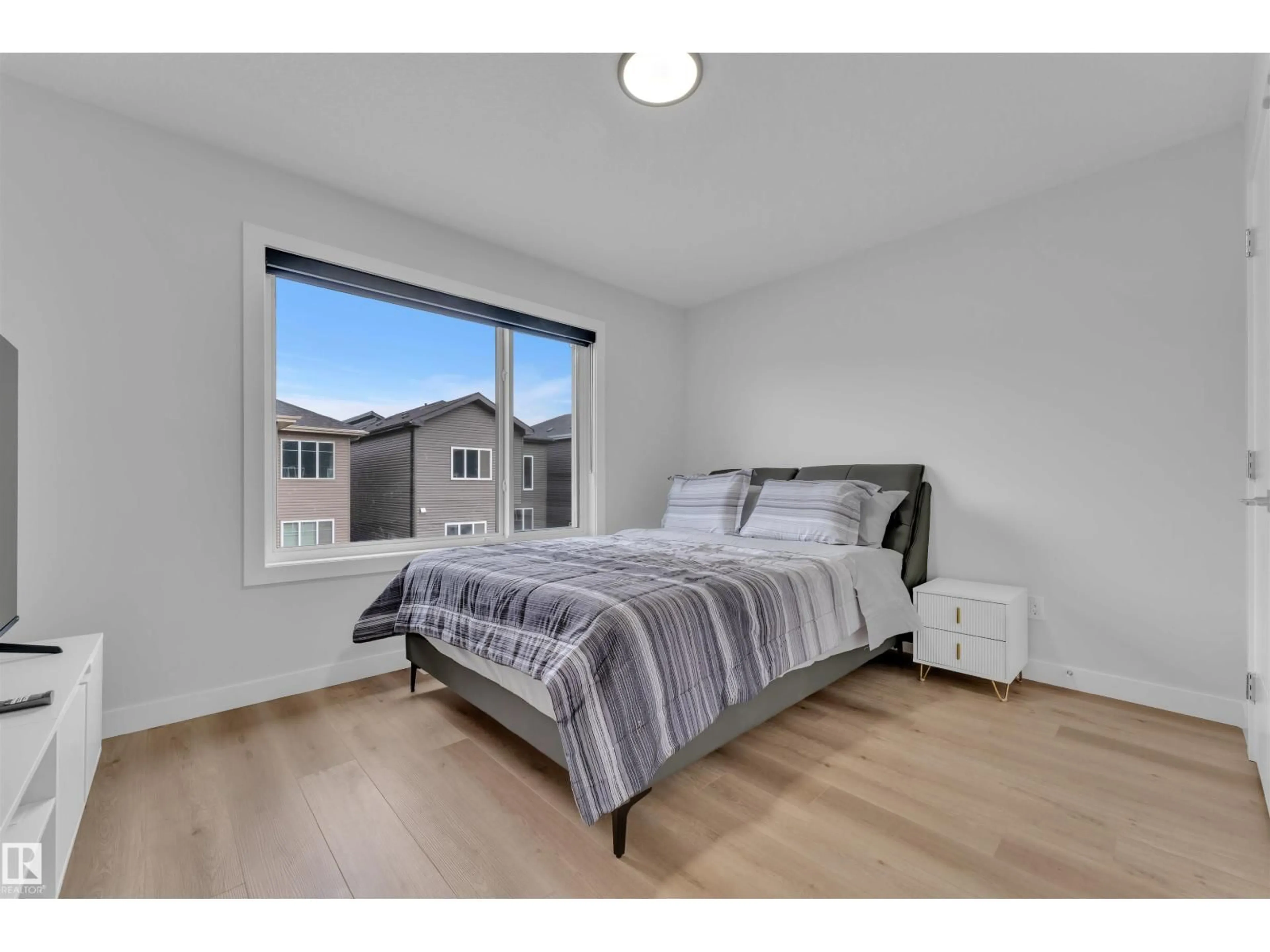 Bedroom with bed, wood/laminate floor for 4013 36 ST, Beaumont Alberta T4X3H3