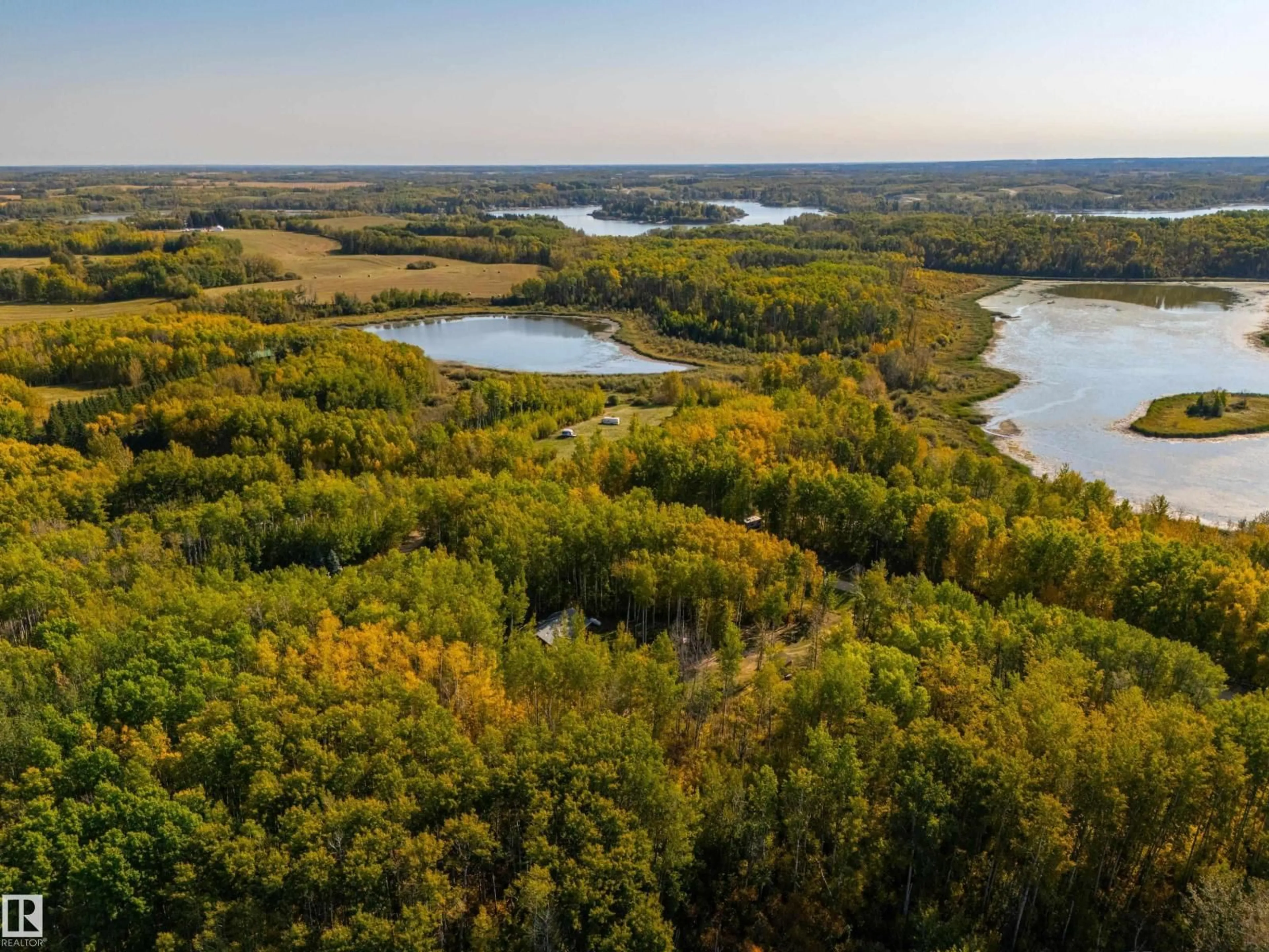 A pic from outside/outdoor area/front of a property/back of a property/a pic from drone, water/lake/river/ocean view for 52229 RGE ROAD 25, Rural Parkland County Alberta T7Y2M3