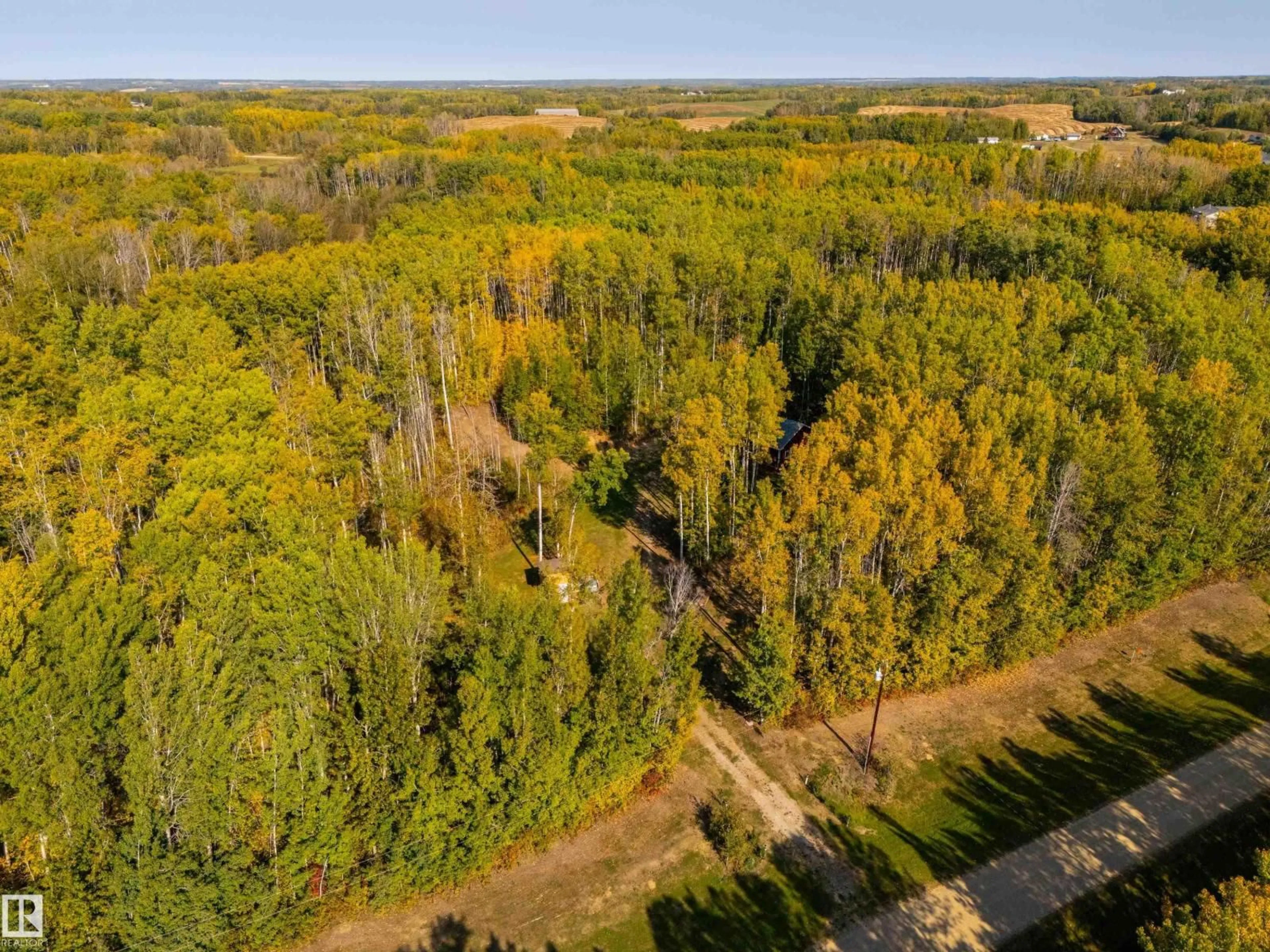 A pic from outside/outdoor area/front of a property/back of a property/a pic from drone, forest/trees view for 52229 RGE ROAD 25, Rural Parkland County Alberta T7Y2M3