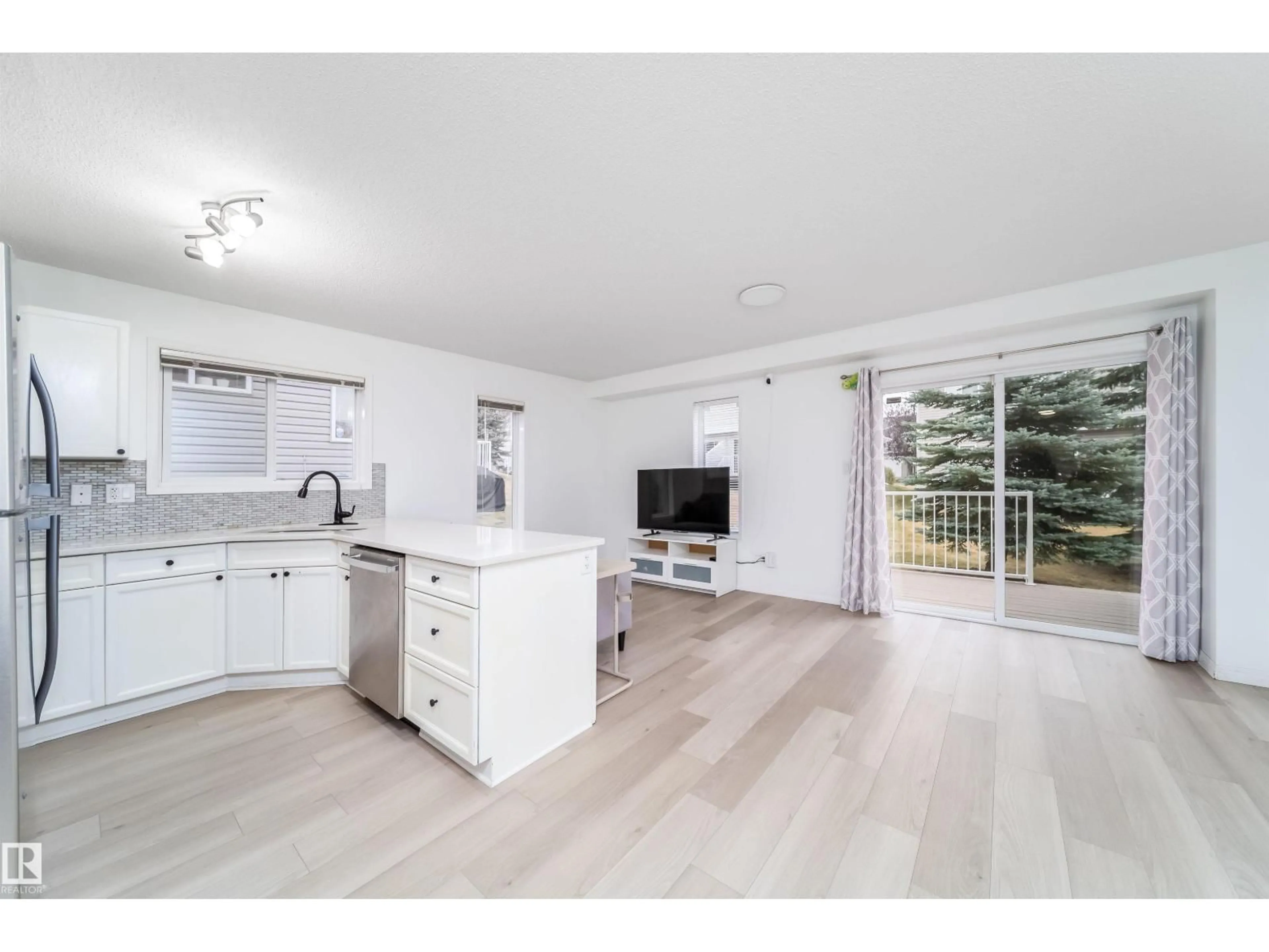Open concept kitchen, wood/laminate floor for #30 - 130 HYNDMAN CR, Edmonton Alberta T5A0E8