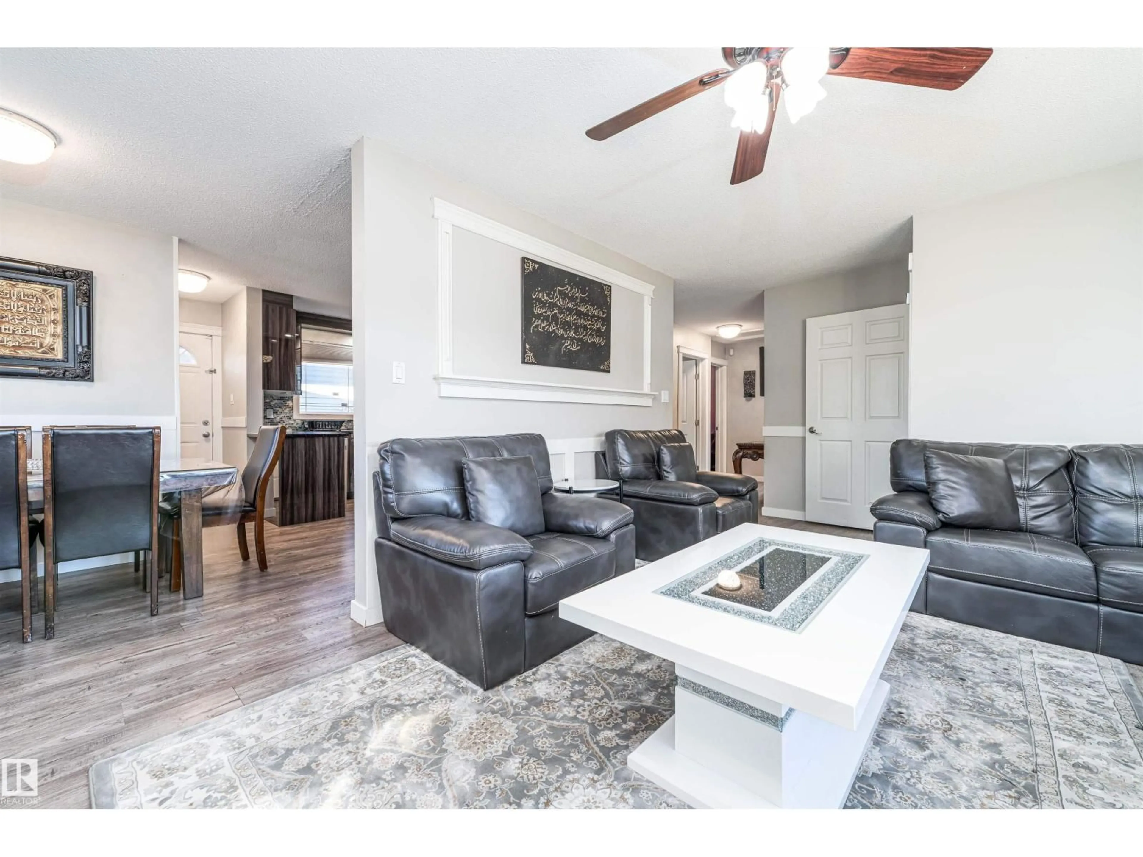 Living room with furniture, wood/laminate floor for NW - 14815 78 ST, Edmonton Alberta T5C1H7