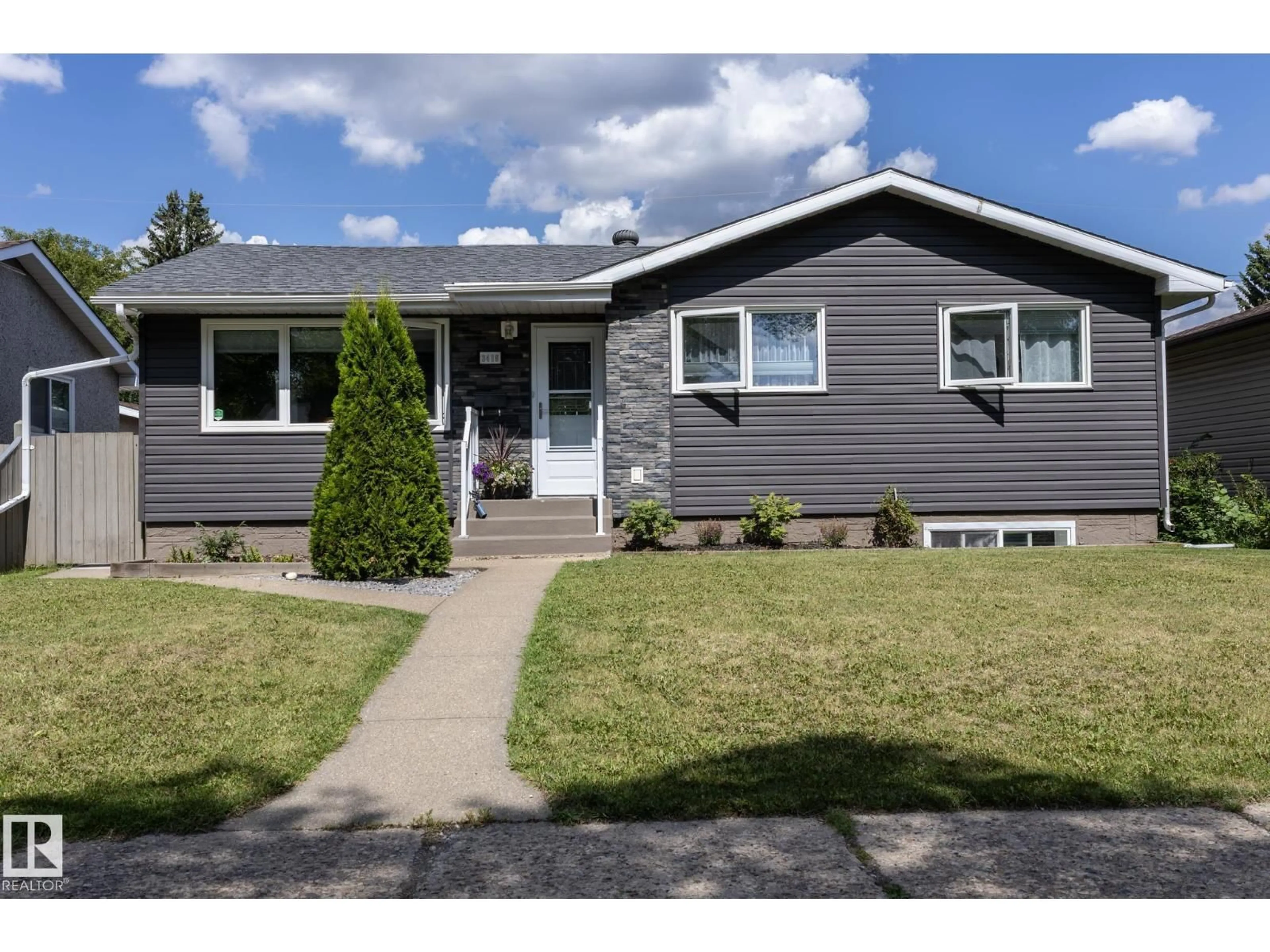 Home with vinyl exterior material, street for 3418 120 AV, Edmonton Alberta T5W1K2