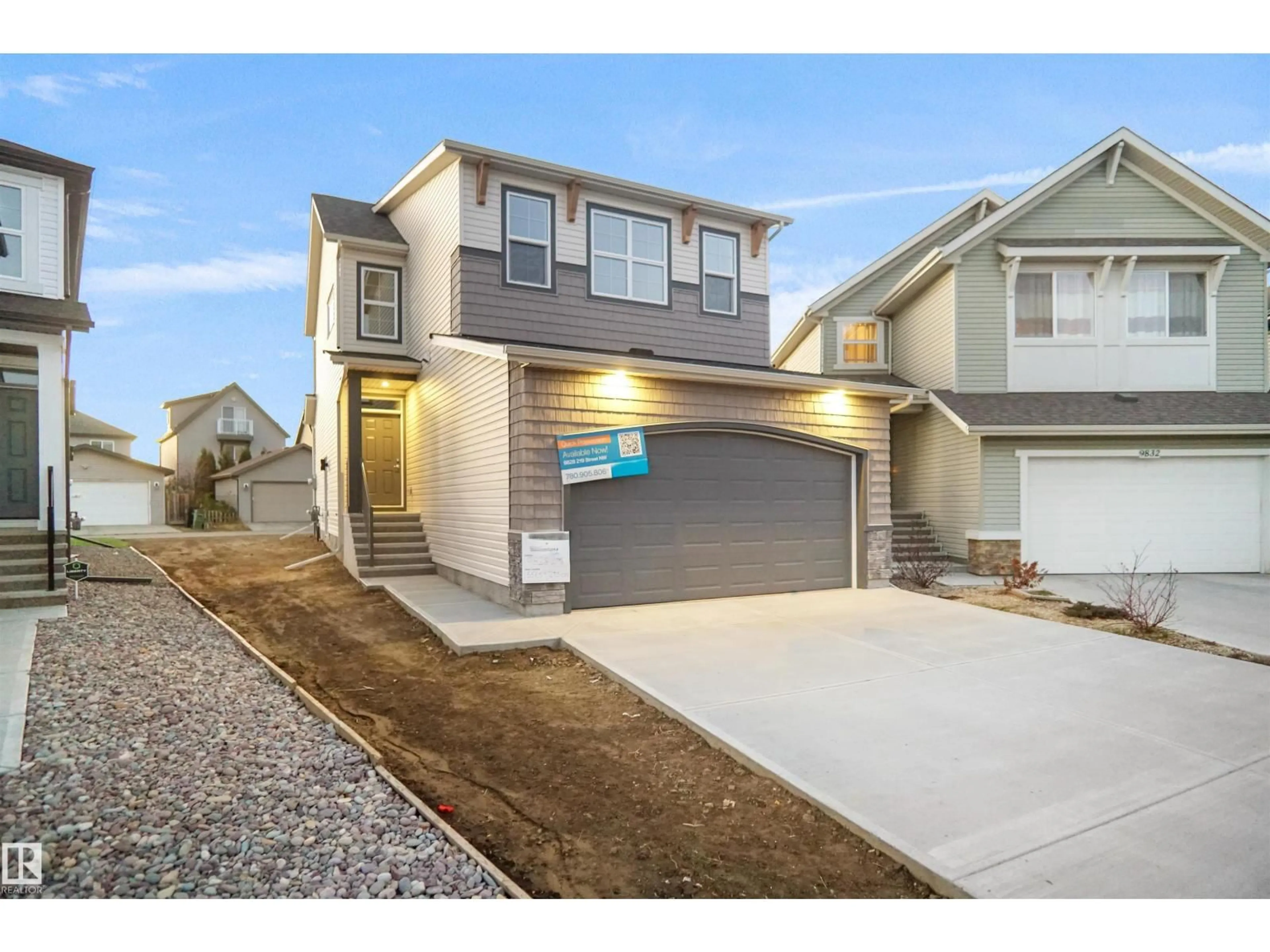 Home with vinyl exterior material, street for NW - 9828 219 ST, Edmonton Alberta T5T7A7