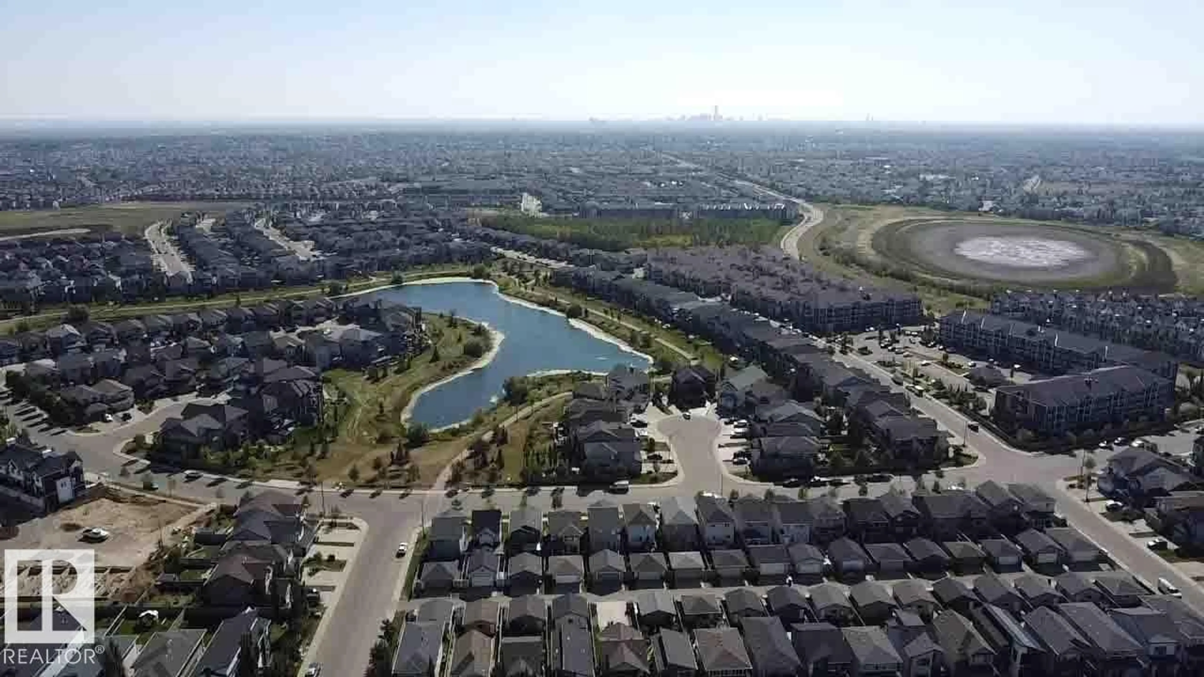 A pic from outside/outdoor area/front of a property/back of a property/a pic from drone, water/lake/river/ocean view for #410 - 18126 77 ST NW, Edmonton Alberta T5Z0N7